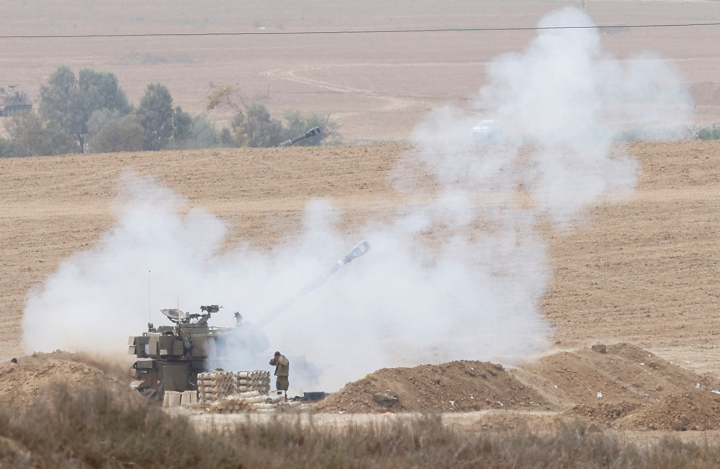 Israeli artillery unit fires from the Israeli side of the Israel Gaza border into Gaza, as the conflict between Israel and the Palestinian Islamist group Hamas continues, near the Israel-Gaza border, Israel October 29, 2023 REUTERS
