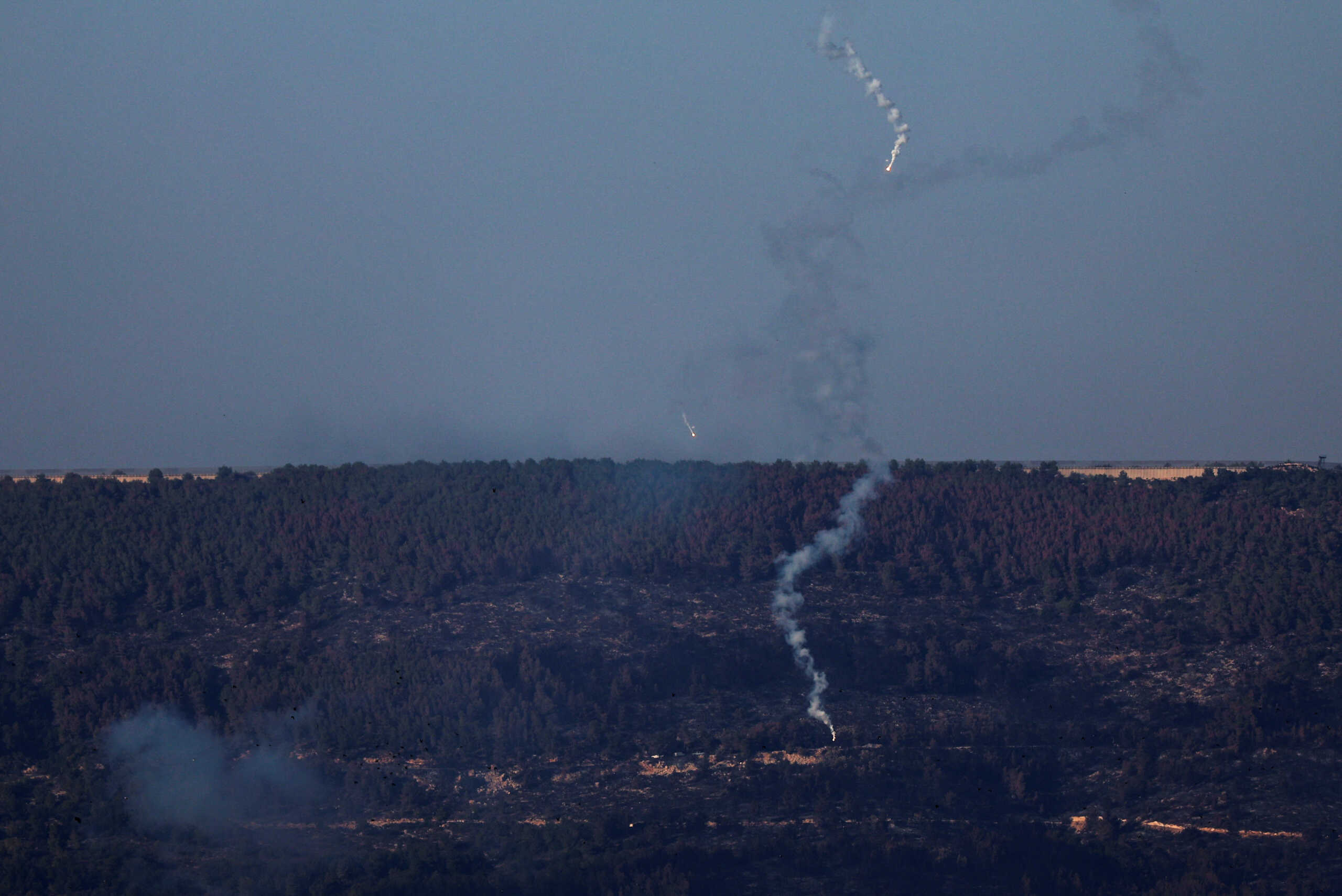 Flares are pictured above the Israel-Lebanon border, as seen from northern Israel, October 25, 2023. REUTERS