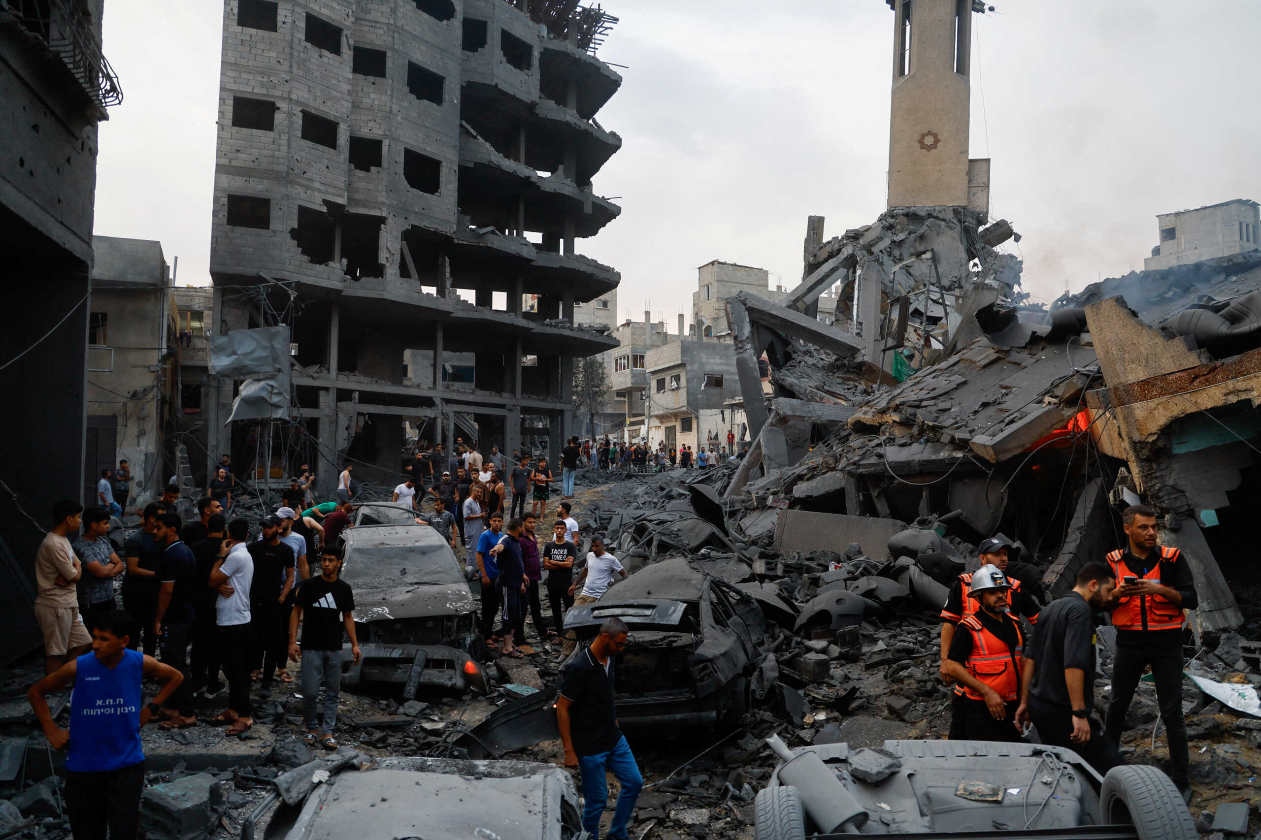 Emergency personnel and Palestinians inspect damages in the aftermath of Israeli strikes, following a Hamas surprise attack, at Beach refugee camp, in Gaza City, October 9, 2023. REUTERS
