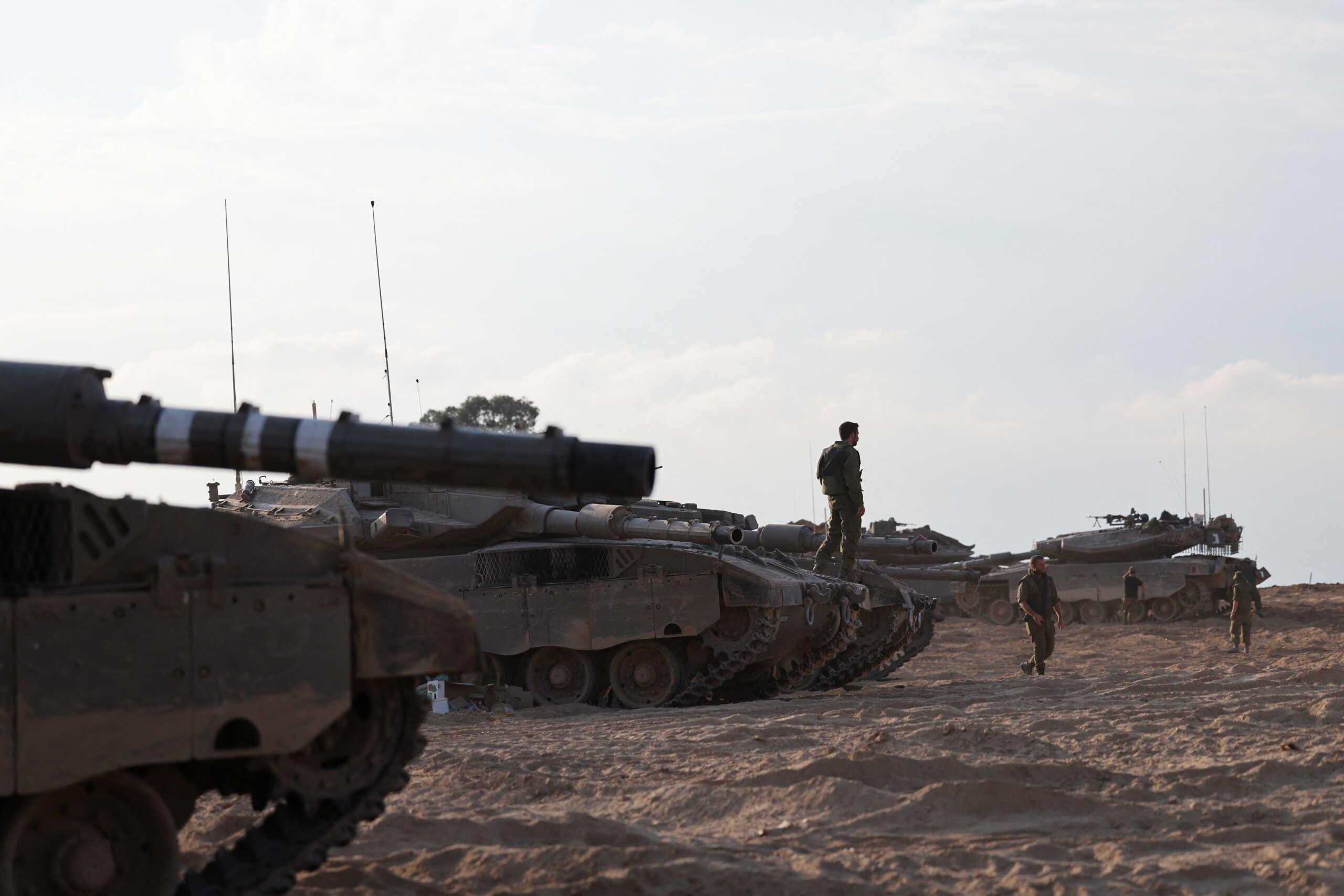 Israeli tanks are seen in the aftermath of a mass infiltration by Hamas gunmen from the Gaza Strip, in Kibbutz Beeri in southern Israel, October 14, 2023. REUTERS