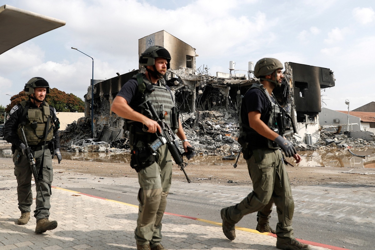 epaselect epa10907031 Israeli security forces walk outside the destroyed police station that was controlled by Hamas militants in the southern city of Sderot, close to the Gaza border, Israel, 08 October 2023. Rocket barrages were launched from the Gaza Strip as of early 07 October in a surprise attack claimed by the Islamist movement Hamas. More than 300 Israelis were killed and over 1,000 left injured in the attacks, the Israeli foreign ministry said.  EPA