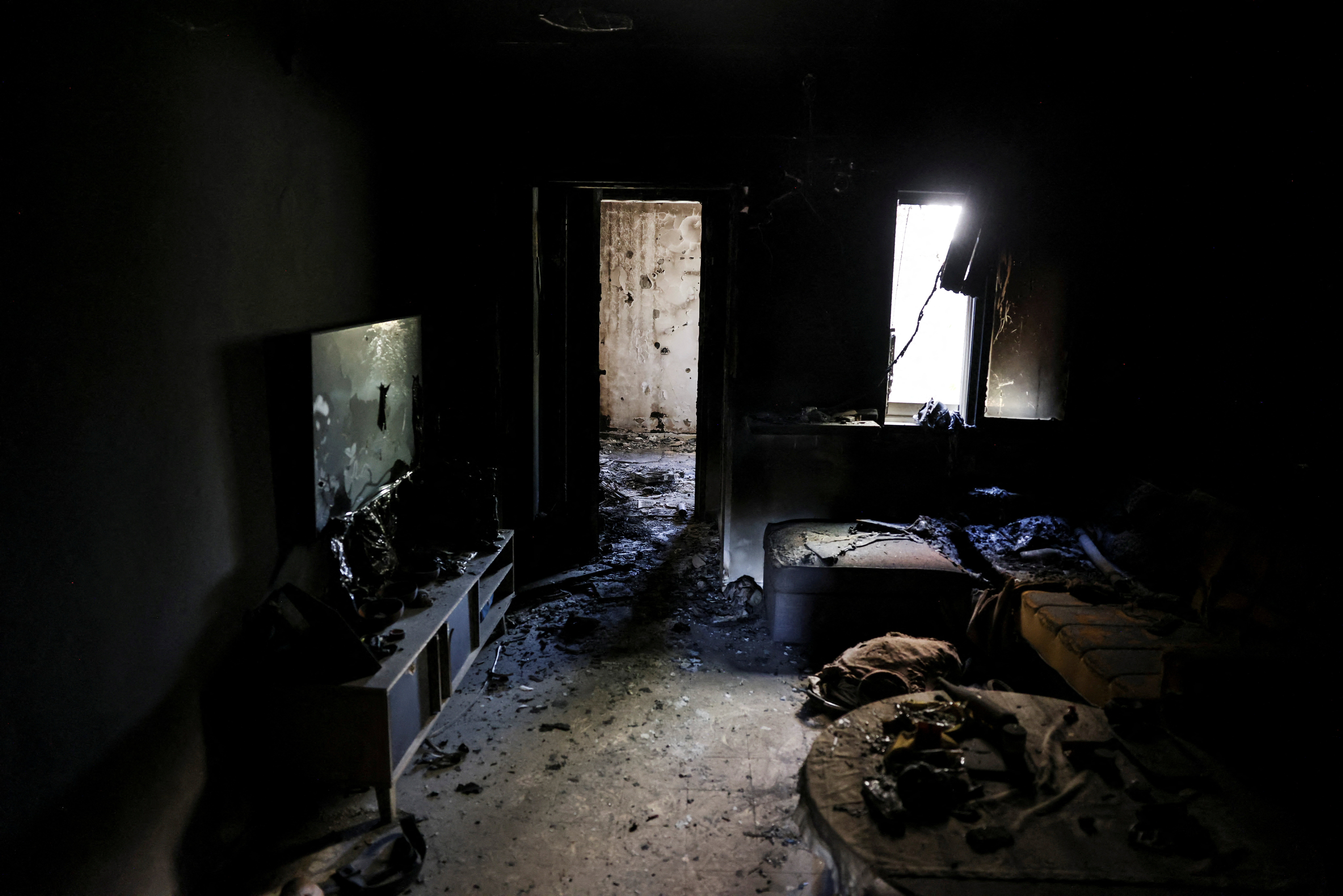 A view shows the living room of a burnt house, following a deadly infiltration by Hamas gunmen from the Gaza Strip, in Kibbutz Kfar Aza in southern Israel, October 15, 2023. REUTERS