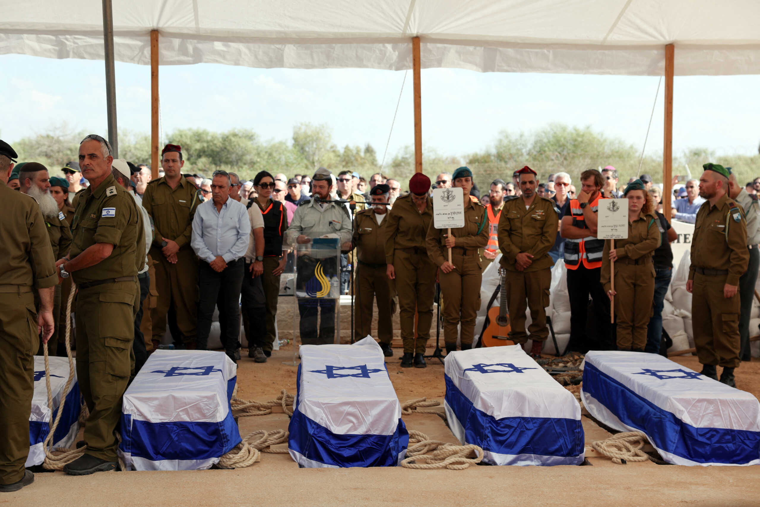 People mourn the entire Kutz family, parents Aviv and Livnat, and three teens Rotem, Yonatan and Yiftach, who were killed following a deadly infiltration by Hamas gunmen from the Gaza Strip, at their funeral in Gan Yavne, in southern Israel, October 17, 2023. REUTERS