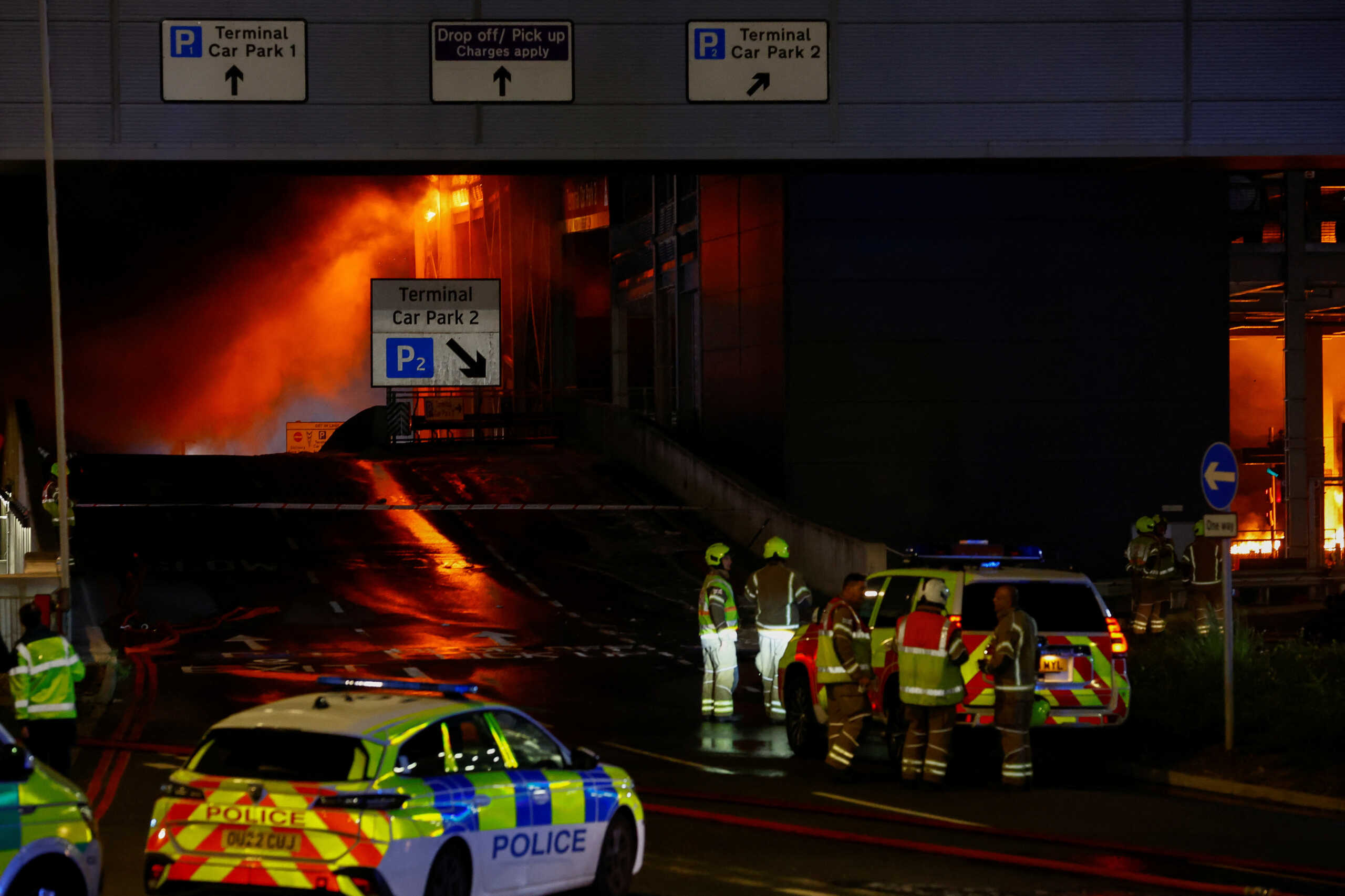 Emergency services respond to a fire in Terminal Car Park 2 at London Luton airport in Luton, Britain, October 11, 2023.  REUTERS