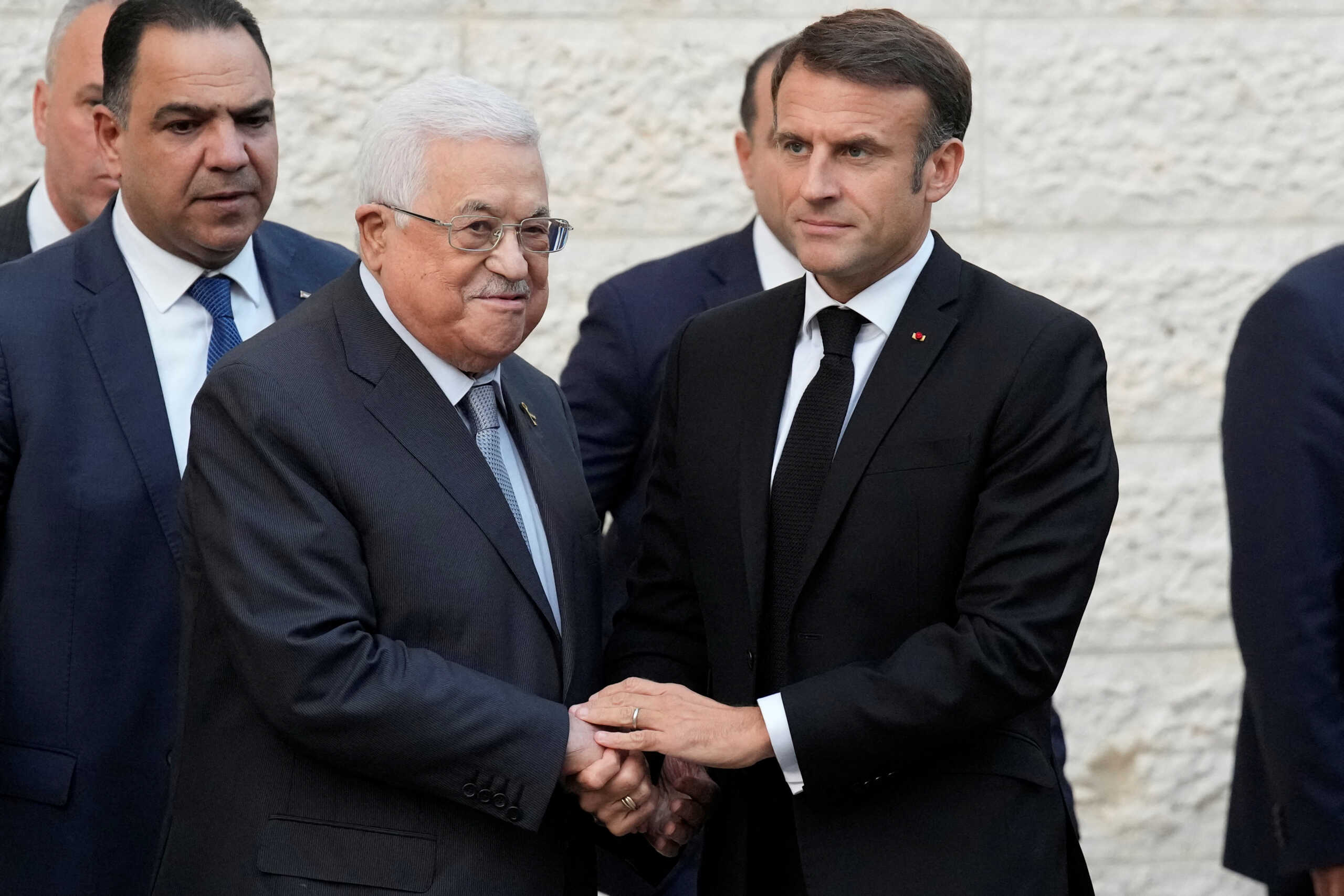 French President Emmanuel Macron shakes hands with the Palestinian President Mahmoud Abbas, in Ramallah, West Bank, October 24, 2023. French President Emmanuel Macron visited Israel on Tuesday, where he reaffirmed calls to prevent the war from expanding into Lebanon and the wider Arab world, and called for a "decisive" political process with the Palestinians for a viable peace. Christophe Ena