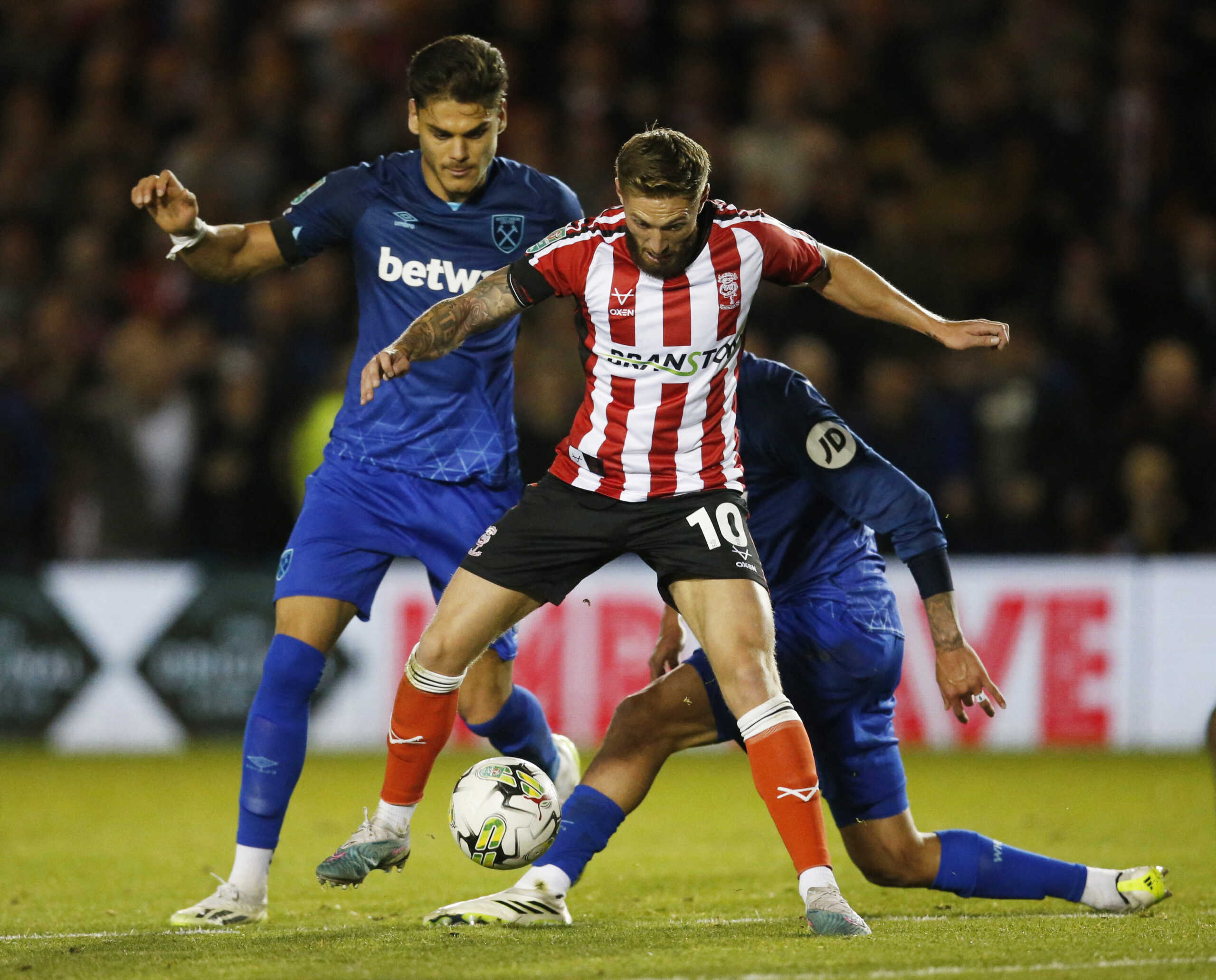 Soccer Football - Carabao Cup - Third Round - Lincoln City v West Ham United - Sincil Bank, Lincoln, Britain - September 27, 2023 West Ham United's Konstantinos Mavropanos in action with Lincoln City's Teddy Bishop Action Images via Reuters