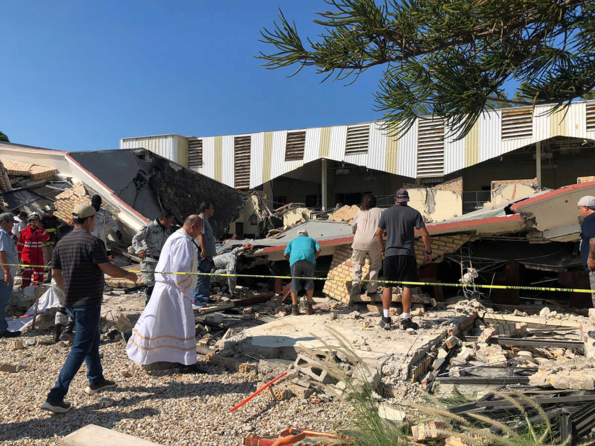 Members of security forces, people and a priest work at a site where a church roof collapsed during Sunday mass in Ciudad Madero, in Tamaulipas state, Mexico in this handout picture distributed to Reuters on October 1, 2023. Secretaria de Seguridad Publica Tamaulipas