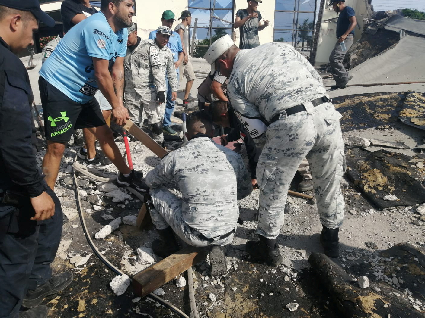 Members of security forces and people work at a site where a church roof collapsed during Sunday mass in Ciudad Madero, in Tamaulipas state, Mexico in this handout picture distributed to Reuters on October 1, 2023. Mexico Presidency
