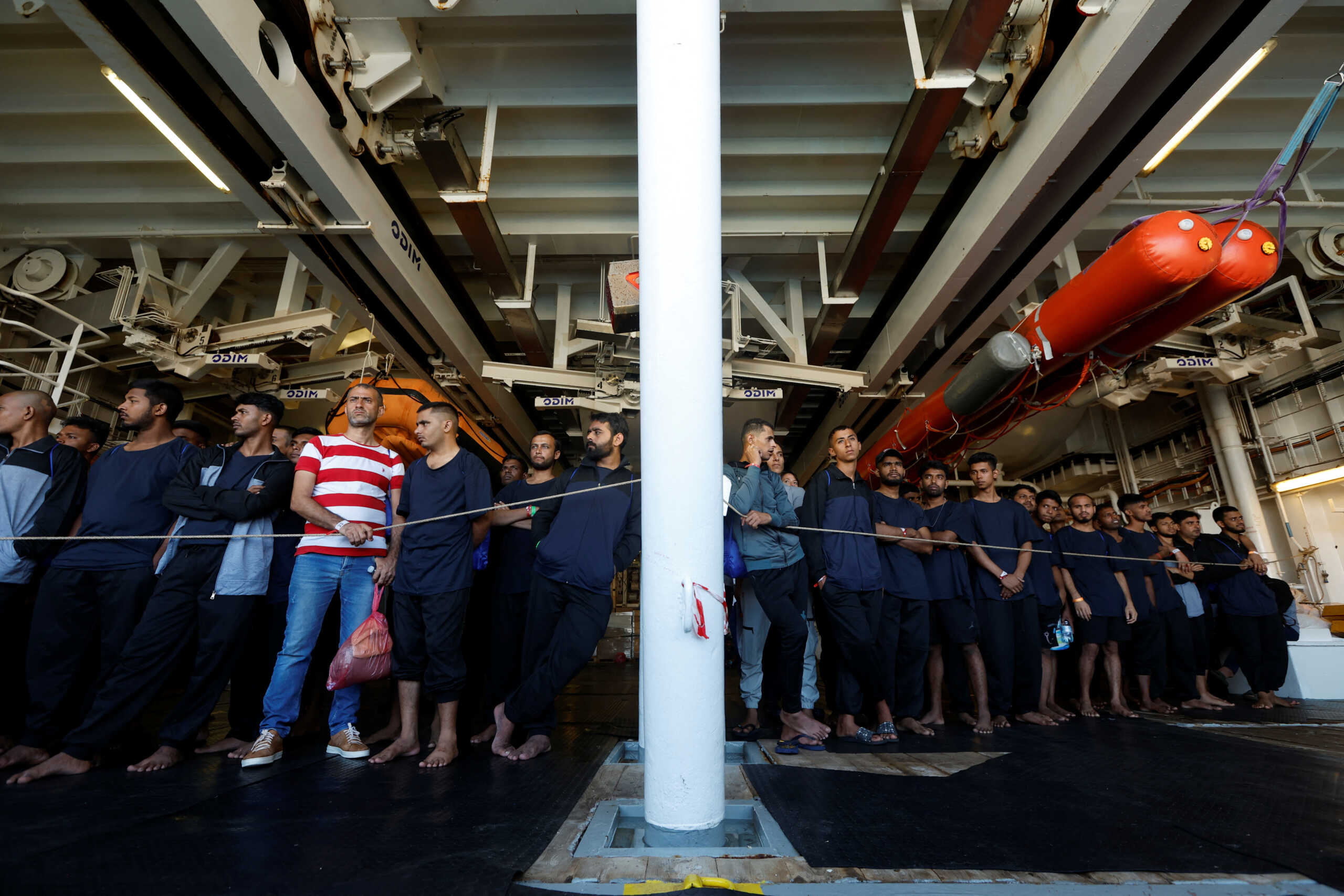 Migrants wait to disembark from the Geo Barents rescue ship, operated by Medecins Sans Frontieres (Doctors Without Borders), in Civitavecchia port, Italy October 1, 2023. REUTERS
