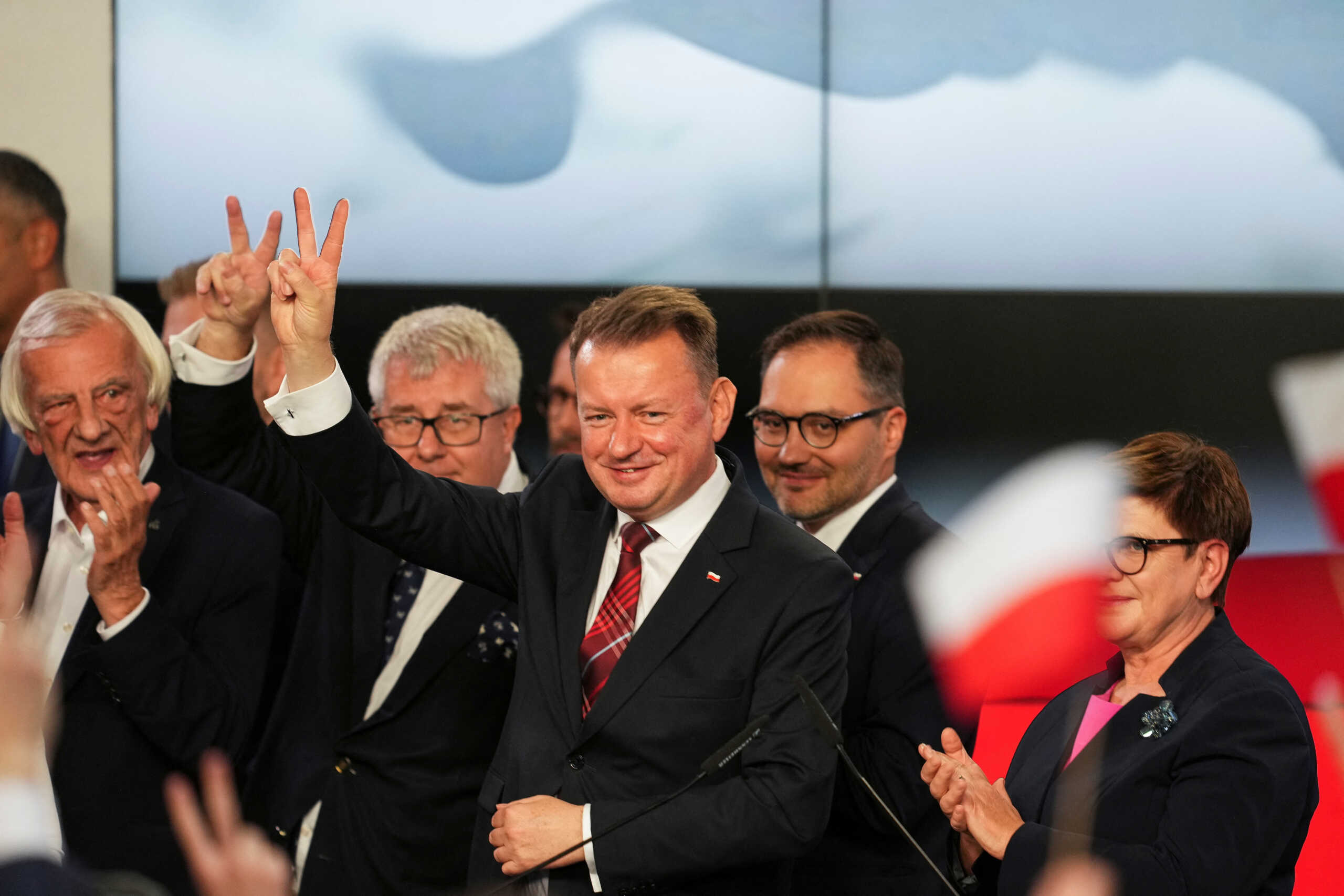 Polish Defence Minister Mariusz Blaszczak gestures after the exit poll results are announced in Warsaw, Poland, October 15, 2023. REUTERS