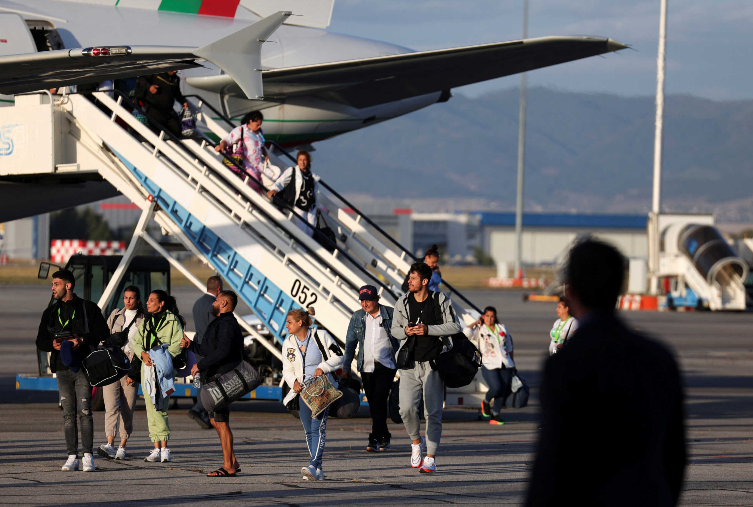 People evacuated from Israel on a Bulgarian government plane arrive at Sofia International Airport, in Sofia, Bulgaria, October 8, 2023. REUTERS