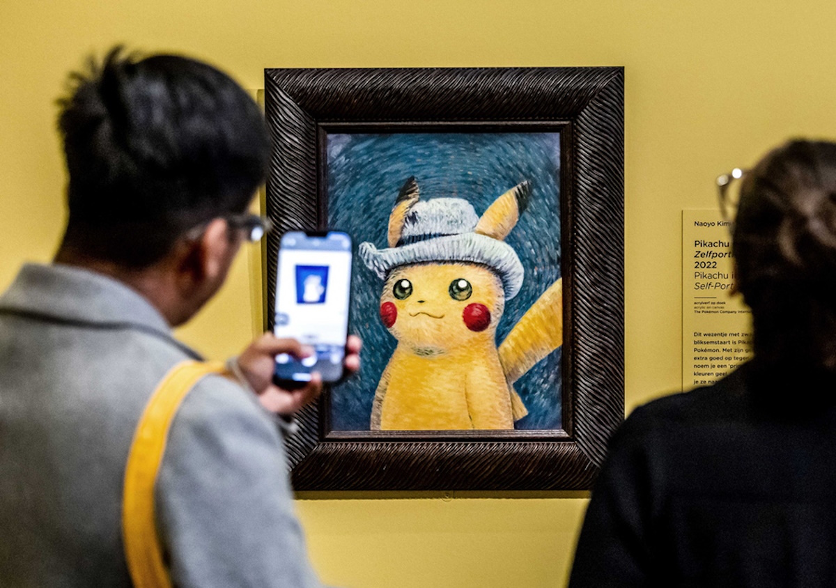 epaselect epa10888485 Visitors look at a painting by an artist who was inspired by Vincent van Gogh's work, at the Van Gogh Museum in Amsterdam, the Netherlands, 28 September 2023. Some of Vincent van Gogh's best-known works inspired six paintings that artists from The Pokemon Company have created of Pokemon. The exhibition runs from 28 September to 07 January 2024.  EPA