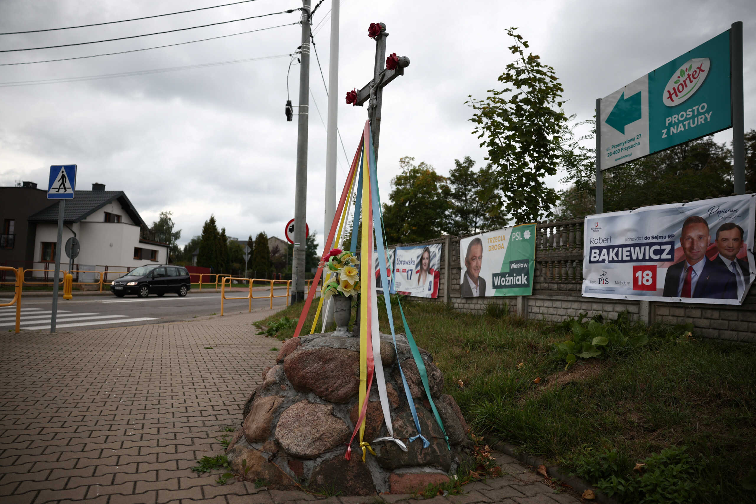 Election posters are seen hanging on the fence, before Sunday's parliamentary elections, in Przysucha, Poland October 9, 2023. REUTERS