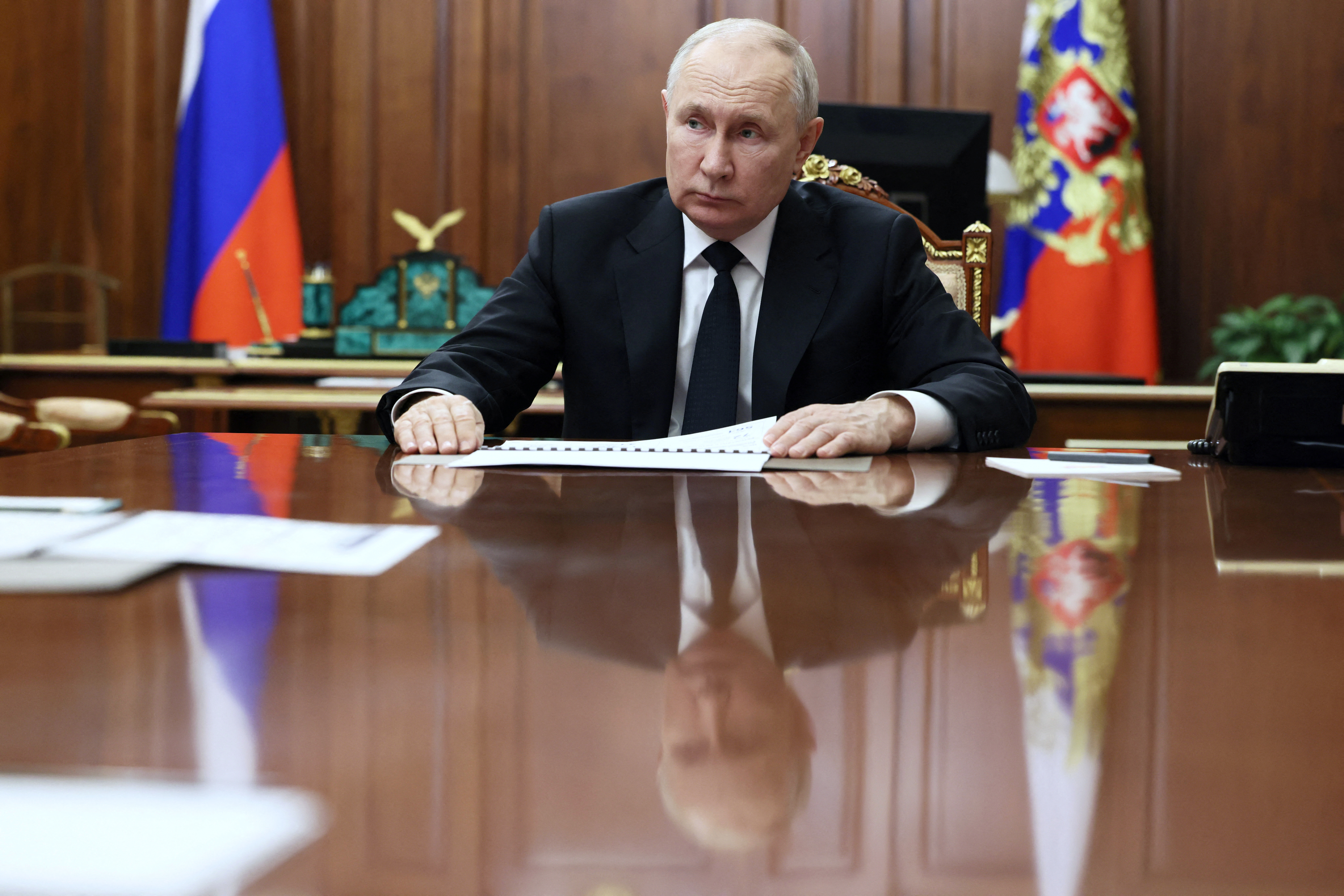 Russian President Vladimir Putin listens to Deputy Prime Minister and Minister of Industry and Trade Denis Manturov during a meeting at the Kremlin in Moscow, Russia October 24, 2023. Sputnik