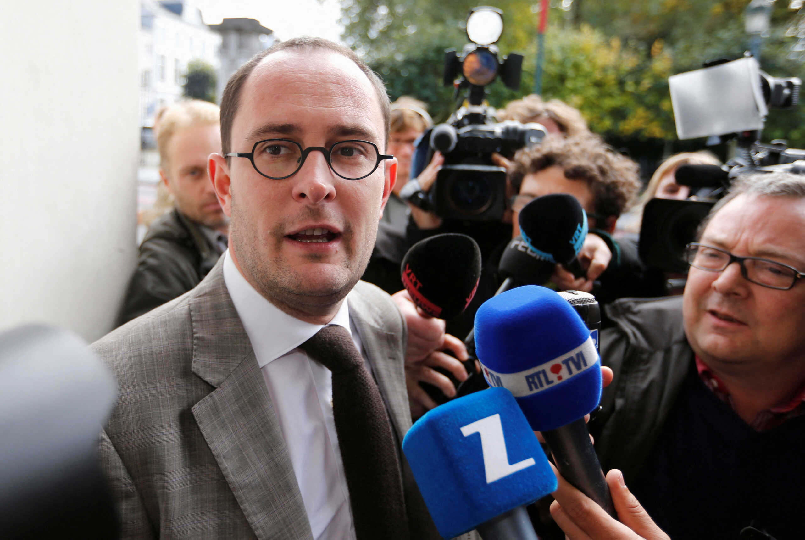 FILE PHOTO: Belgium's then- Pensions Minister Vincent Van Quickenborne talks to the media as he arrives at a budgetary control meeting in Brussels October 17, 2012. REUTERS