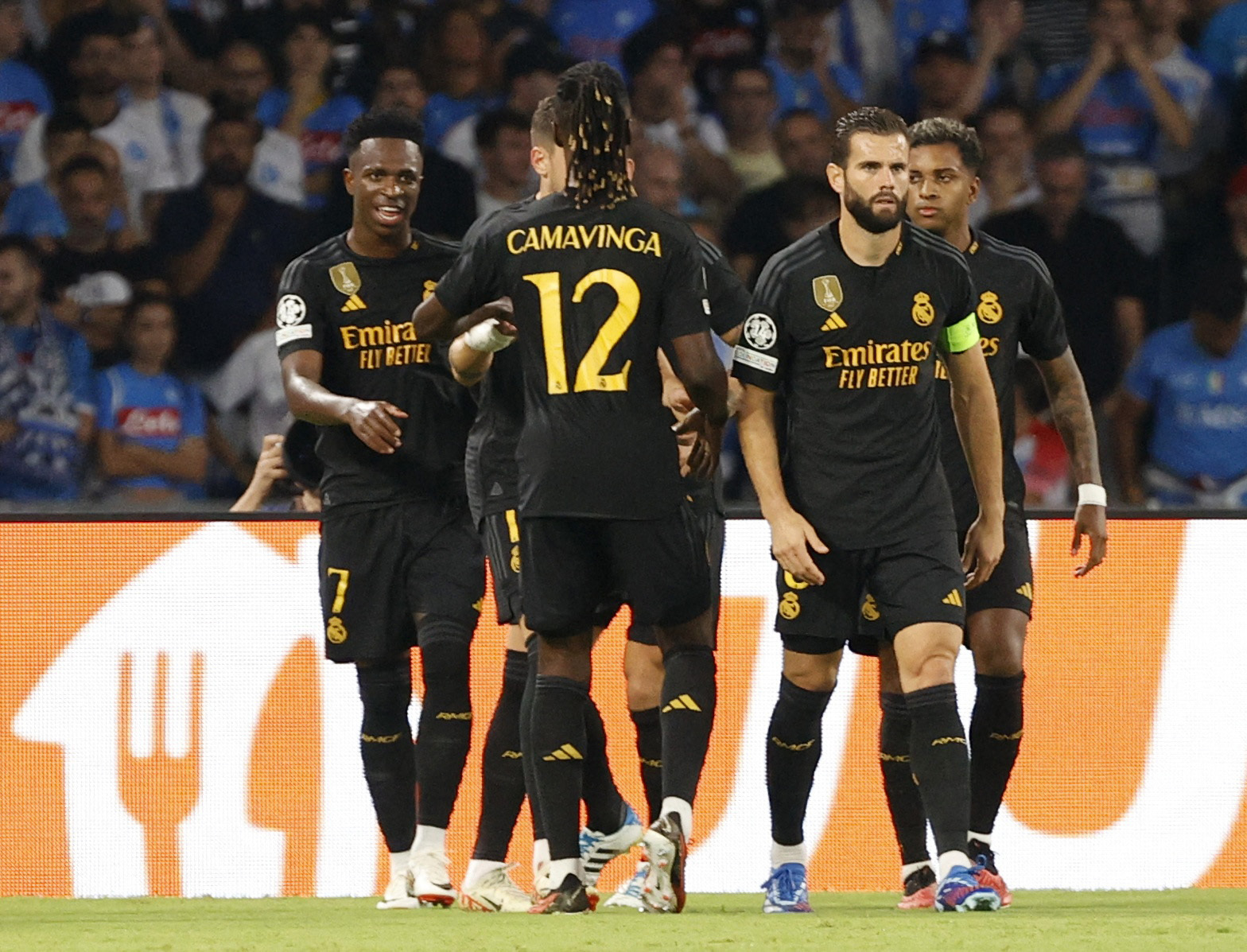 Soccer Football - Champions League - Group C - Napoli v Real Madrid - Stadio Diego Armando Maradona, Naples, Italy - October 3, 2023 Real Madrid's Vinicius Junior celebrates scoring their first goal with teammates REUTERS