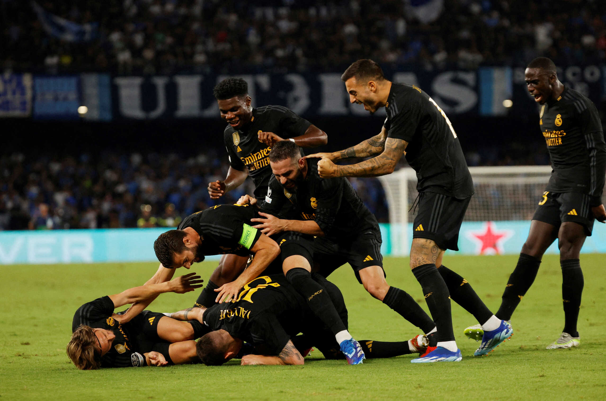 Soccer Football - Champions League - Group C - Napoli v Real Madrid - Stadio Diego Armando Maradona, Naples, Italy - October 3, 2023 Real Madrid players celebrate after Napoli's Alex Meret scores an own goal and the third for Real Madrid REUTERS