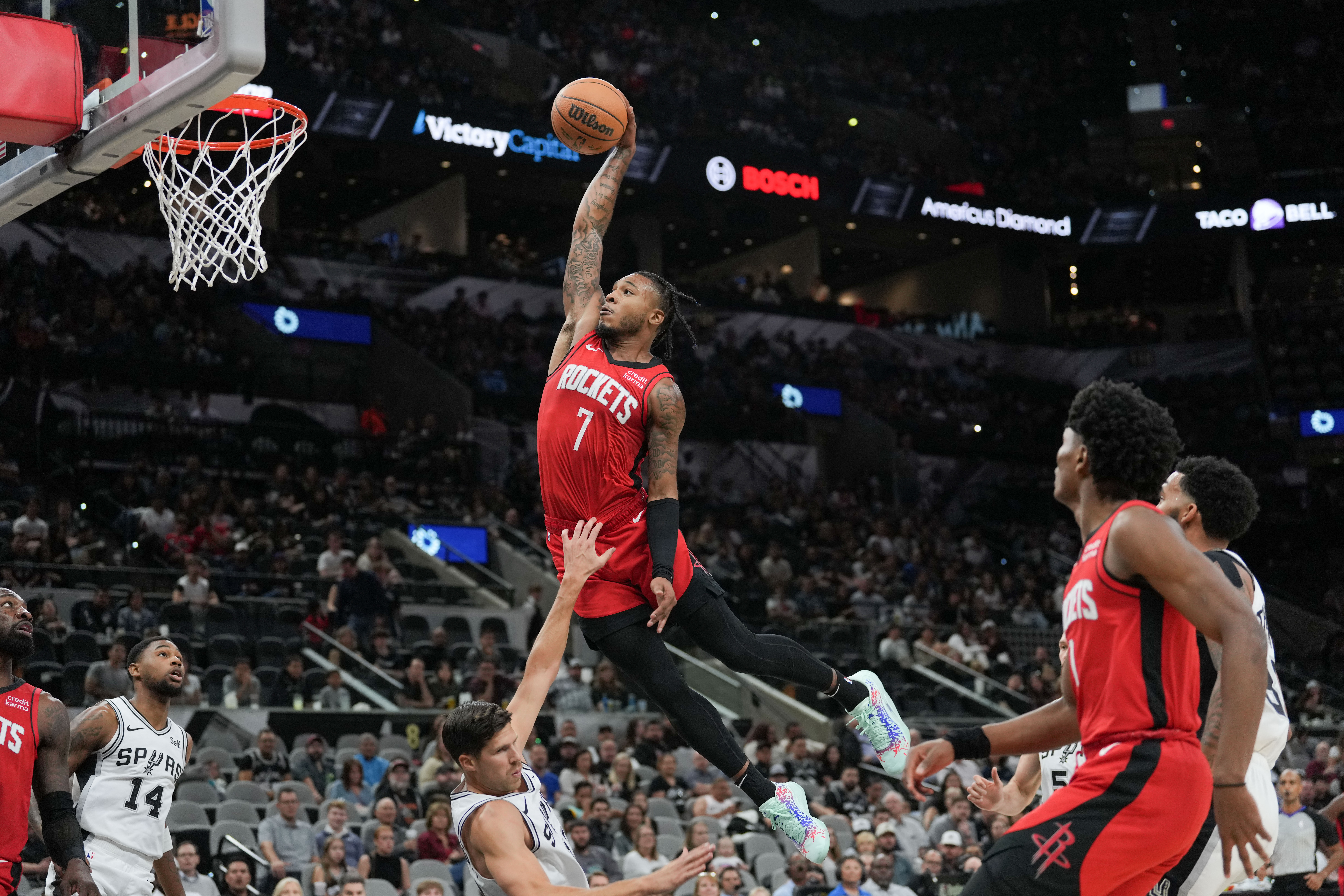 Oct 16, 2023; San Antonio, Texas, USA;  Houston Rockets guard Cam Whitmore (7) shoots over San Antonio Spurs forward Doug McDermott (17) in the first half at the Frost Bank Center. Mandatory Credit: Daniel Dunn-USA TODAY Sports
