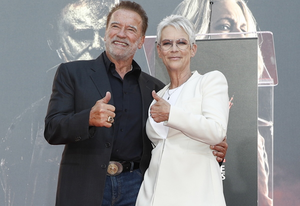 epa10239586 US actor Jamie Lee Curtis (R) and Austrian-American actor and former Governor of California Arnold Schwarzenegger (L) pose during Curtis's hand and footprint ceremony at TCL Chinese Theater in Los Angeles, California, USA, 12 October 2022.  EPA