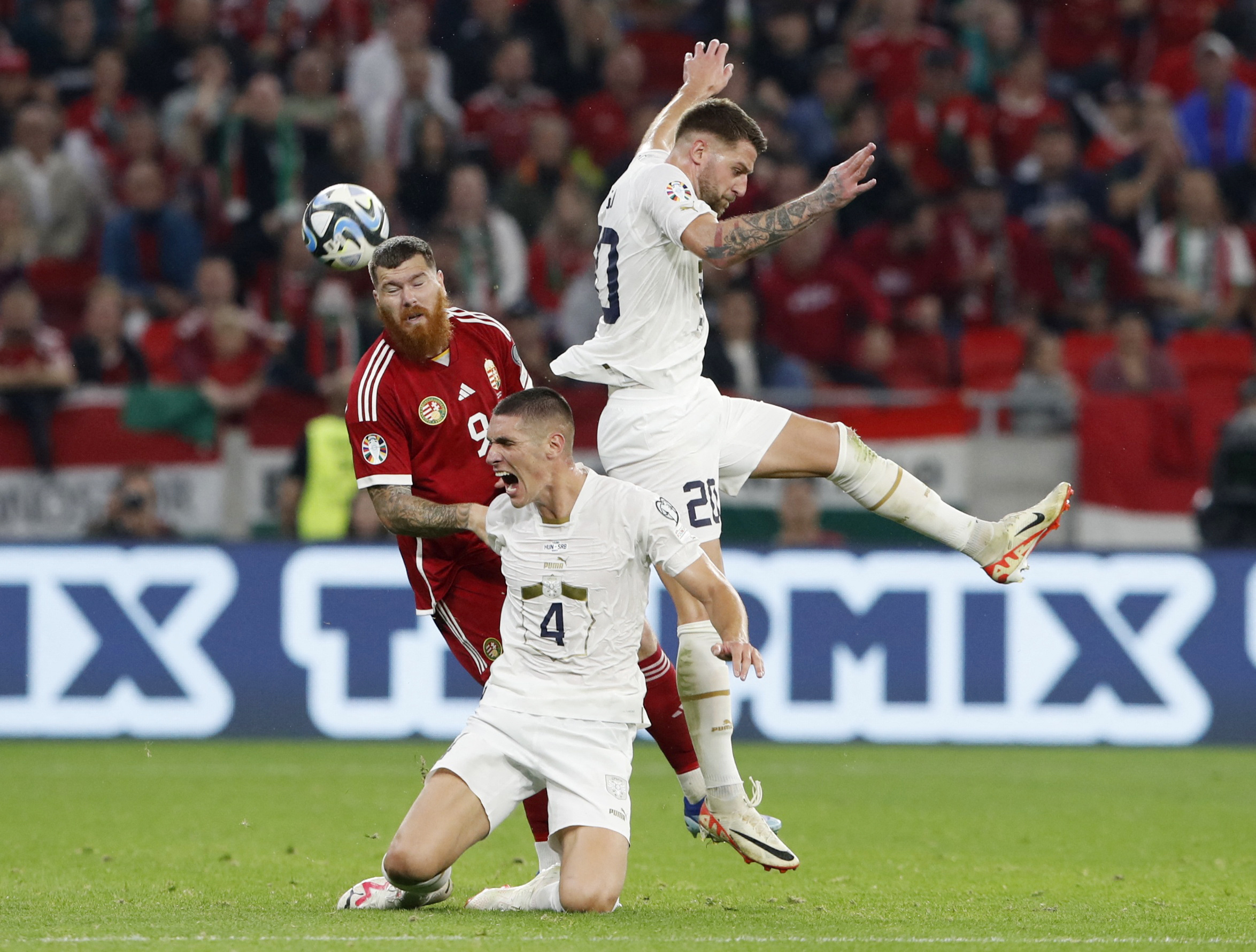 Soccer Football - Euro 2024 Qualifier - Group G - Hungary v Serbia - Puskas Arena, Budapest, Hungary - October 14, 2023 Serbia's Nikola Milenkovic and Sergej Milinkovic-Savic in action with Hungary's Martin Adam REUTERS