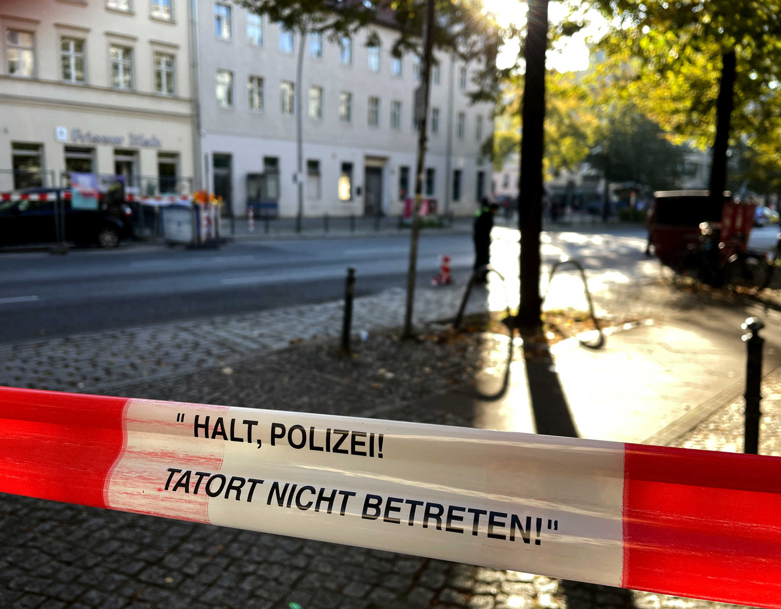 Police secure the street with a sign "stop police - do not enter the crime scene"after two molotov cocktails were thrown at a synagogue overnight in Berlin, Germany, October 18, 2023.     REUTERS