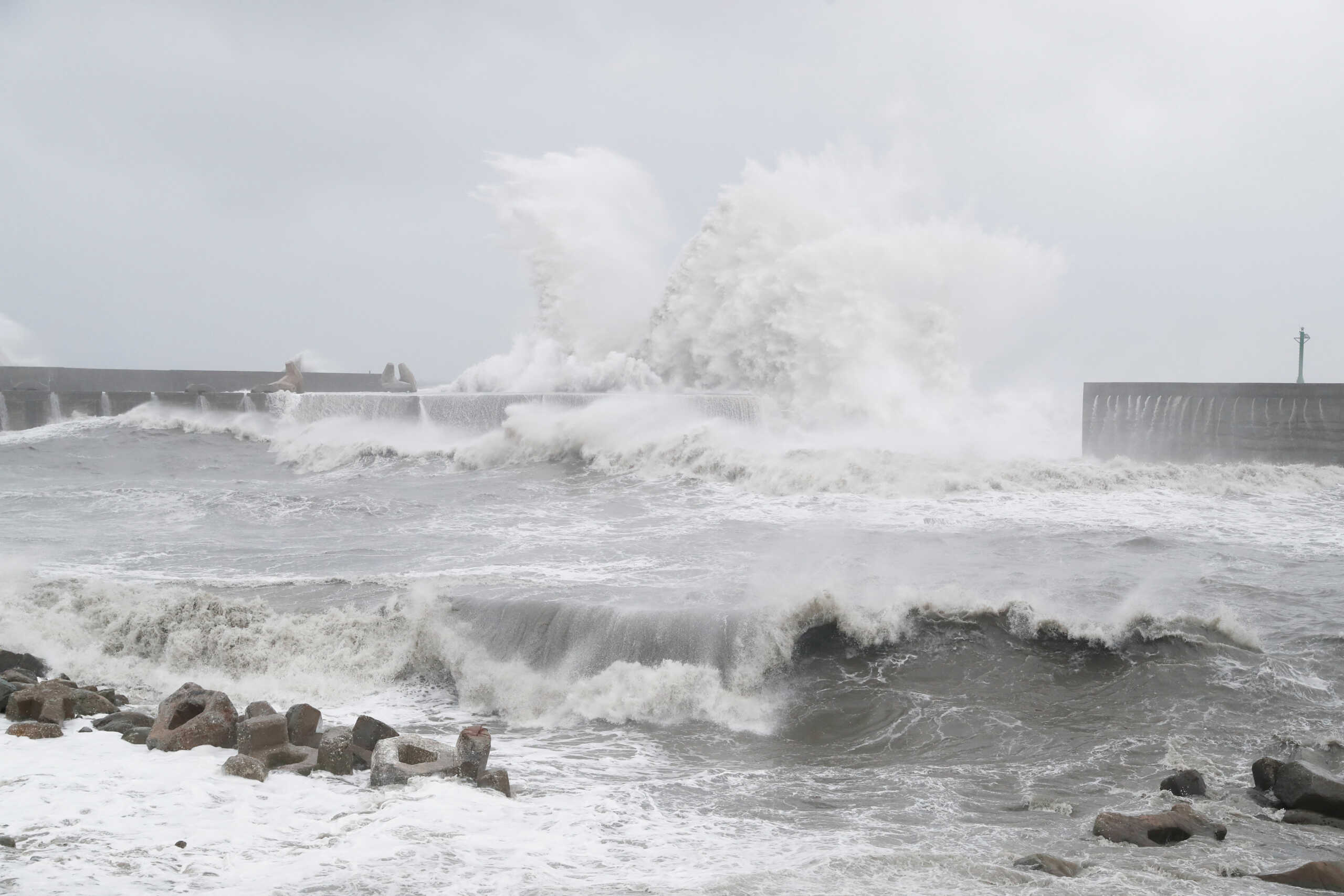 Waves break against the protecting walls of the Fugang Fishing Harbour as Typhoon Koinu moves past the southern tip of Taiwan, in Taitung, Taiwan October 5, 2023. REUTERS