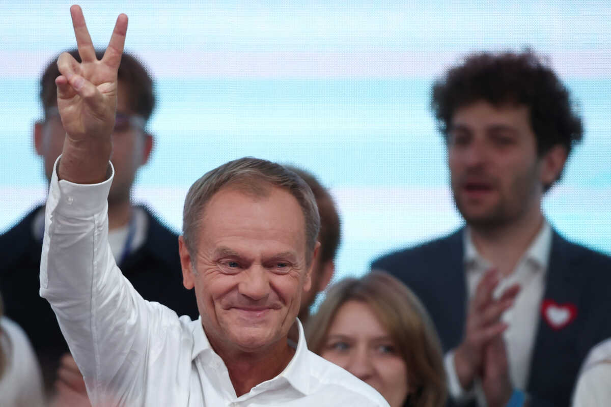 Donald Tusk, leader of the largest opposition grouping Civic Coalition (KO), gestures after the exit poll results are announced in Warsaw, Poland, October 15, 2023. REUTERS