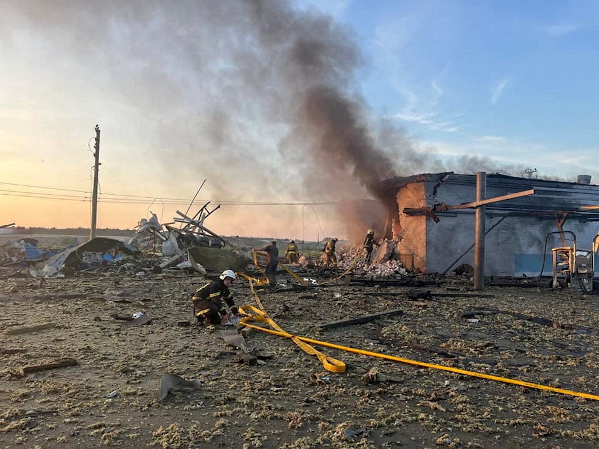 FILE PHOTO: Firefighters work at a site of a car wash heavily damaged by a Russian missile strike, amid Russia's attack on Ukraine, in the town of Uman, Cherkasy region, Ukraine, in this handout picture released June 9, 2023. Press service of the State Emergency Service of Ukraine in Cherkasy region