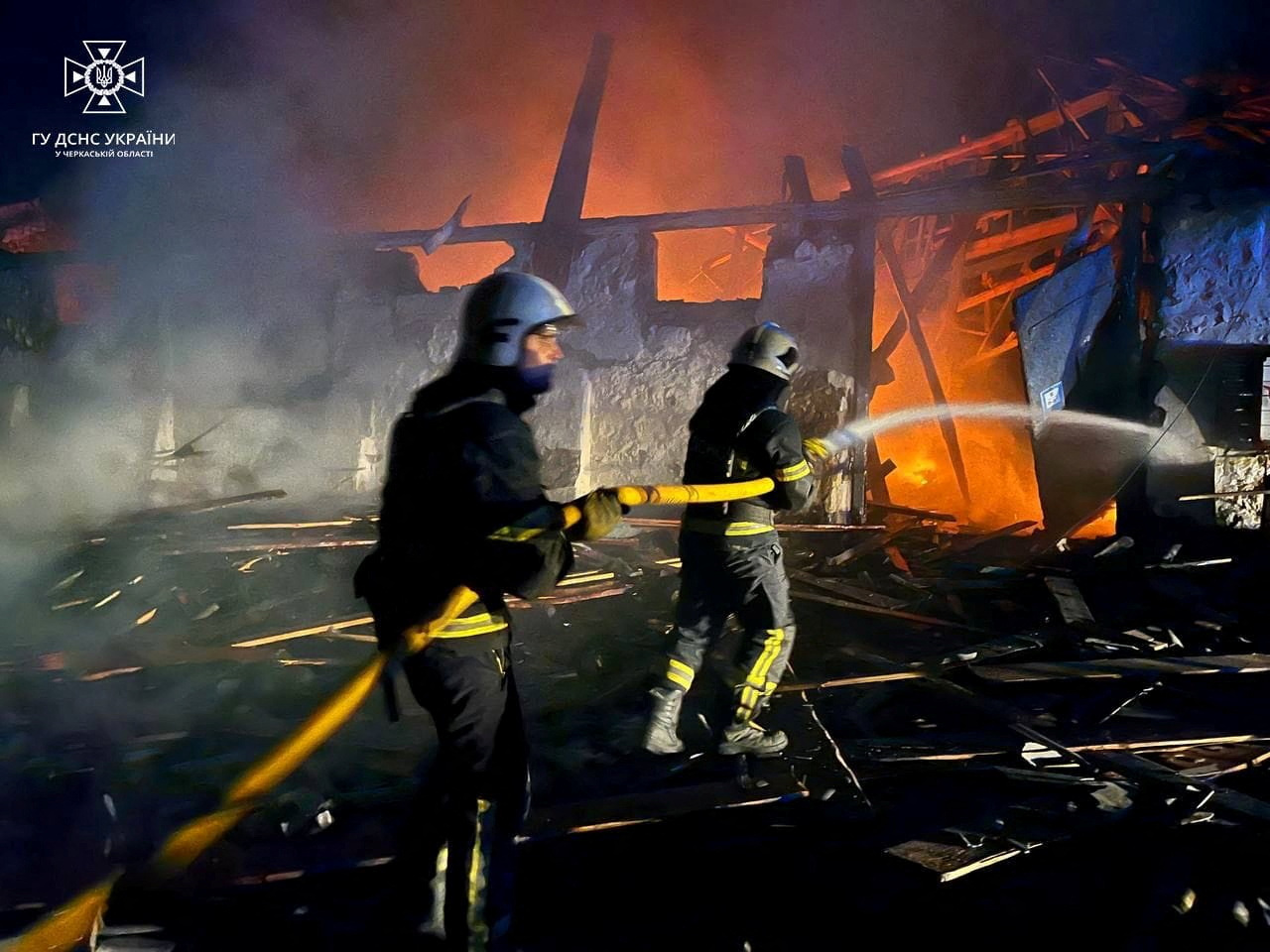 Firefighters work at a site of grain warehouses hit during a Russian drone strike, amid Russia's attack, in Uman, Cherkasy region, Ukraine October 1, 2023. Press service of the State Emergency Service of Ukraine in Cherkasy region