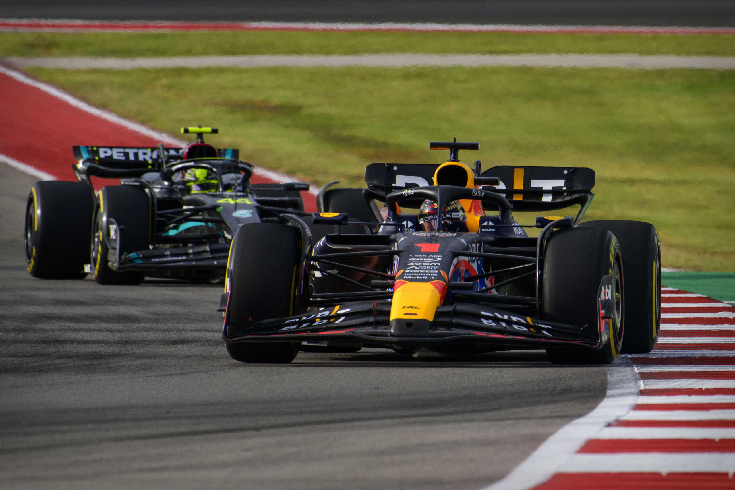 Oct 21, 2023; Austin, Texas, USA; Red Bull Racing Honda driver Max Verstappen (1) of Team Netherlands and driver Lewis Hamilton (44) drives during the Sprint Race of the 2023 United States Grand Prix at Circuit of the Americas. Mandatory Credit: Jerome Miron-USA TODAY Sports