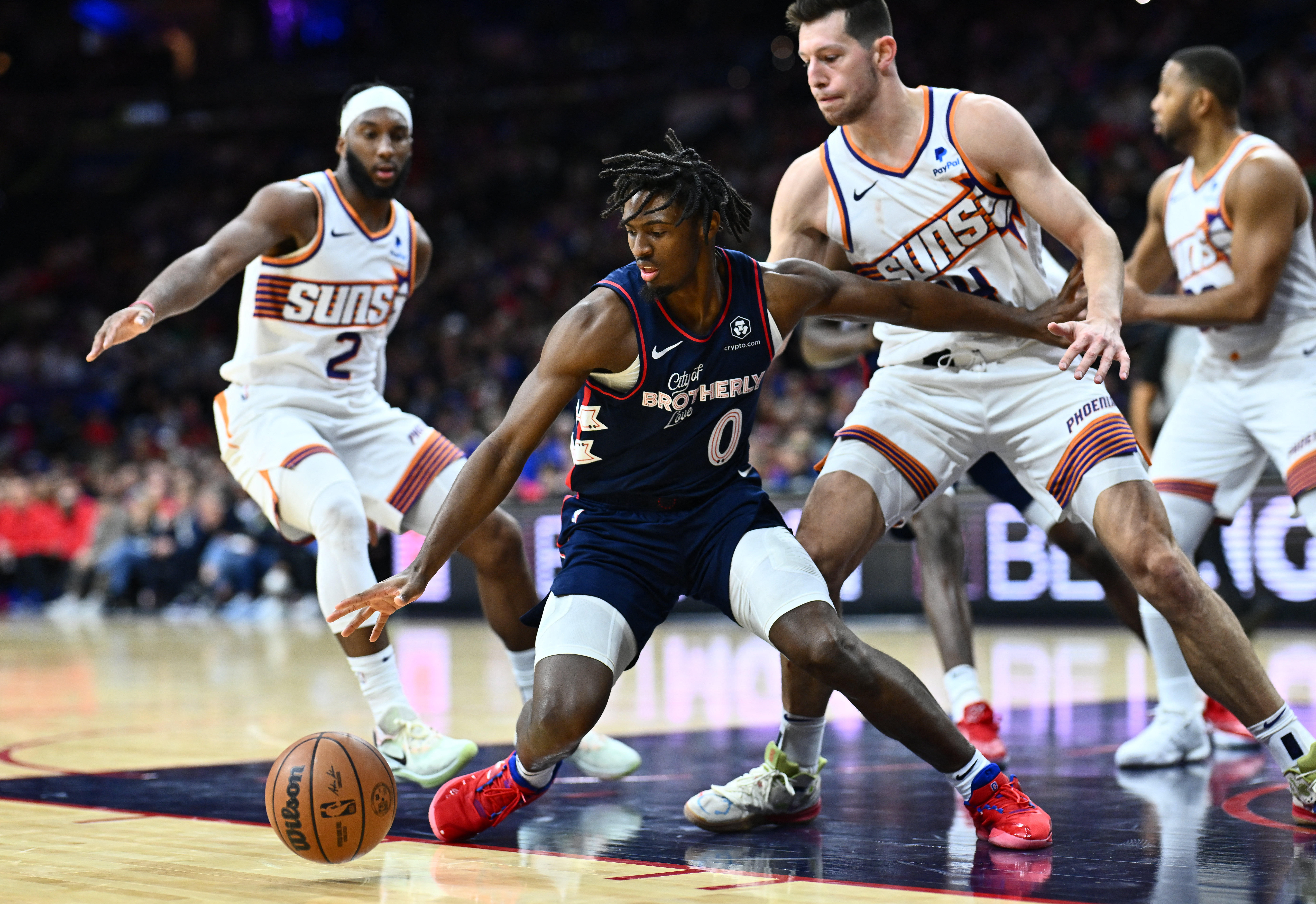 Nov 4, 2023; Philadelphia, Pennsylvania, USA; Philadelphia 76ers guard Tyrese Maxey (0) reaches for the ball against Phoenix Suns forward Drew Eubanks (14) in the fourth quarter at Wells Fargo Center. Mandatory Credit: Kyle Ross-USA TODAY Sports