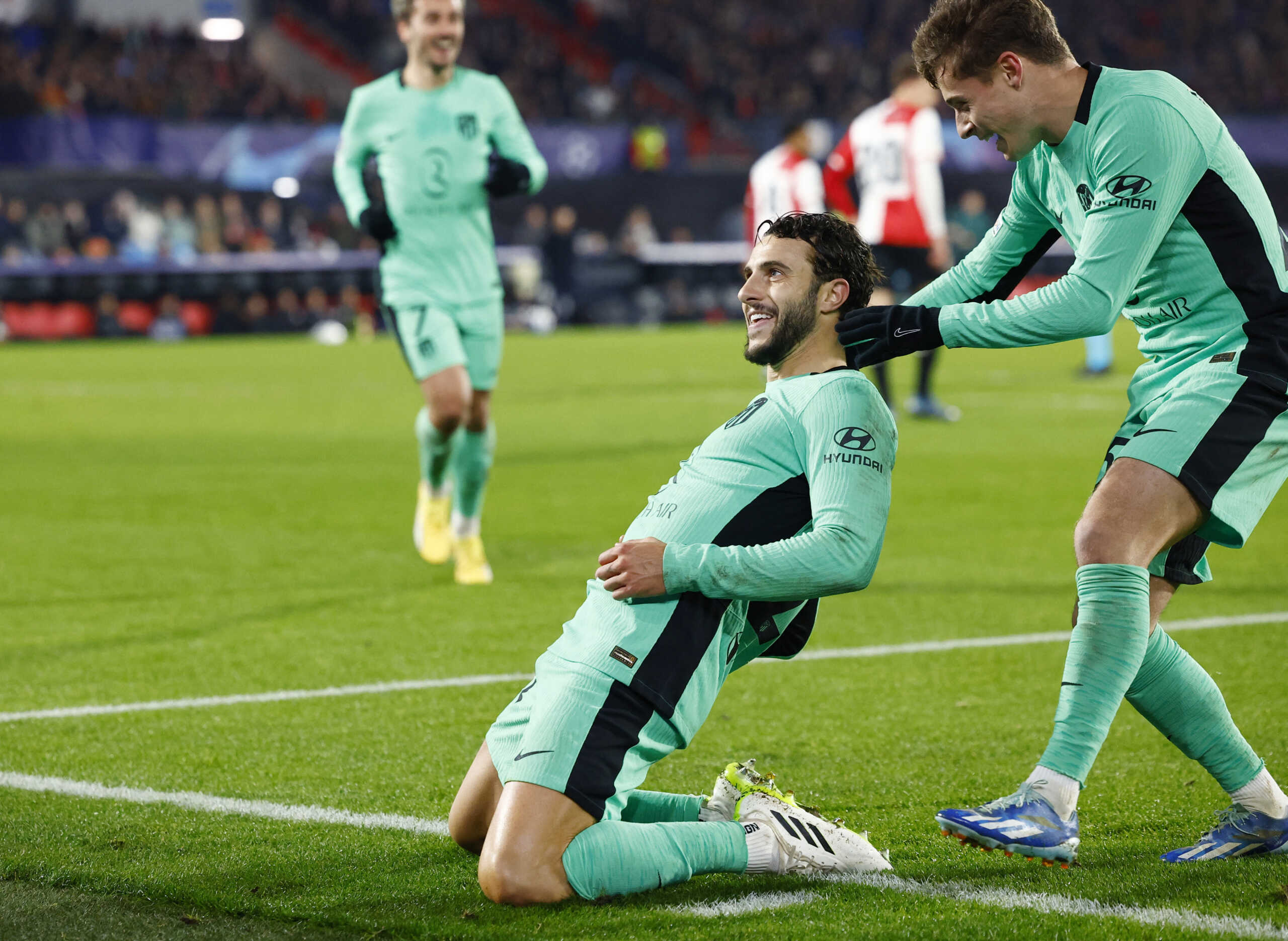 Soccer Football - Champions League - Group E - Feyenoord v Atletico Madrid - De Kuip, Rotterdam, Netherlands - November 28, 2023 Atletico Madrid's Mario Hermoso celebrates scoring their second goal with teammates REUTERS