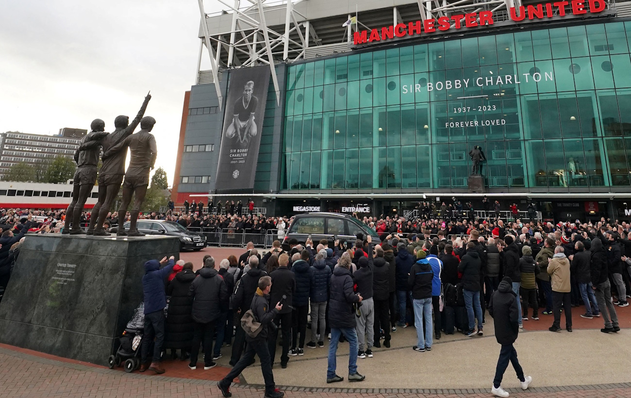 Soccer Football - Funeral of former England and Manchester United footballer Bobby Charlton - Manchester Cathedral, Manchester, Britain - November 13, 2023  The funeral cortege of Bobby Charlton passes by Old Trafford   Pool via REUTERS
