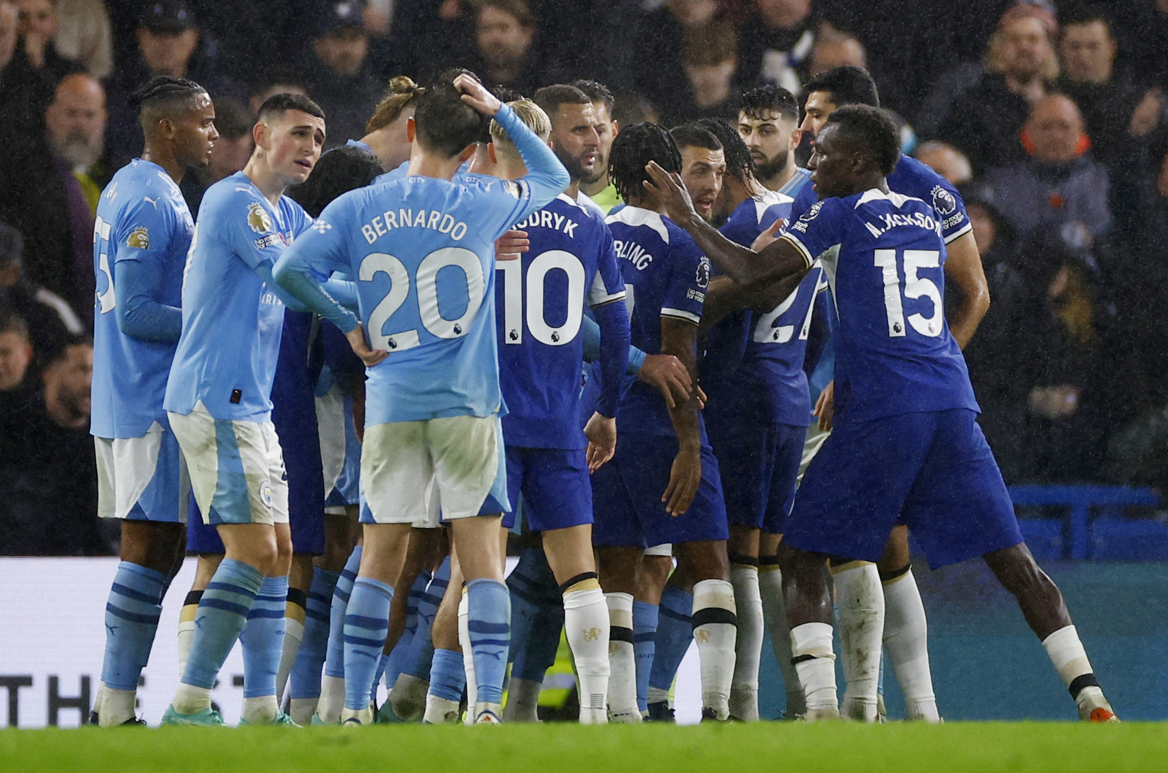 Soccer Football - Premier League - Chelsea v Manchester City - Stamford Bridge, London, Britain - November 12, 2023 Players from both teams clash after a penalty is awarded to Chelsea Action Images via Reuters