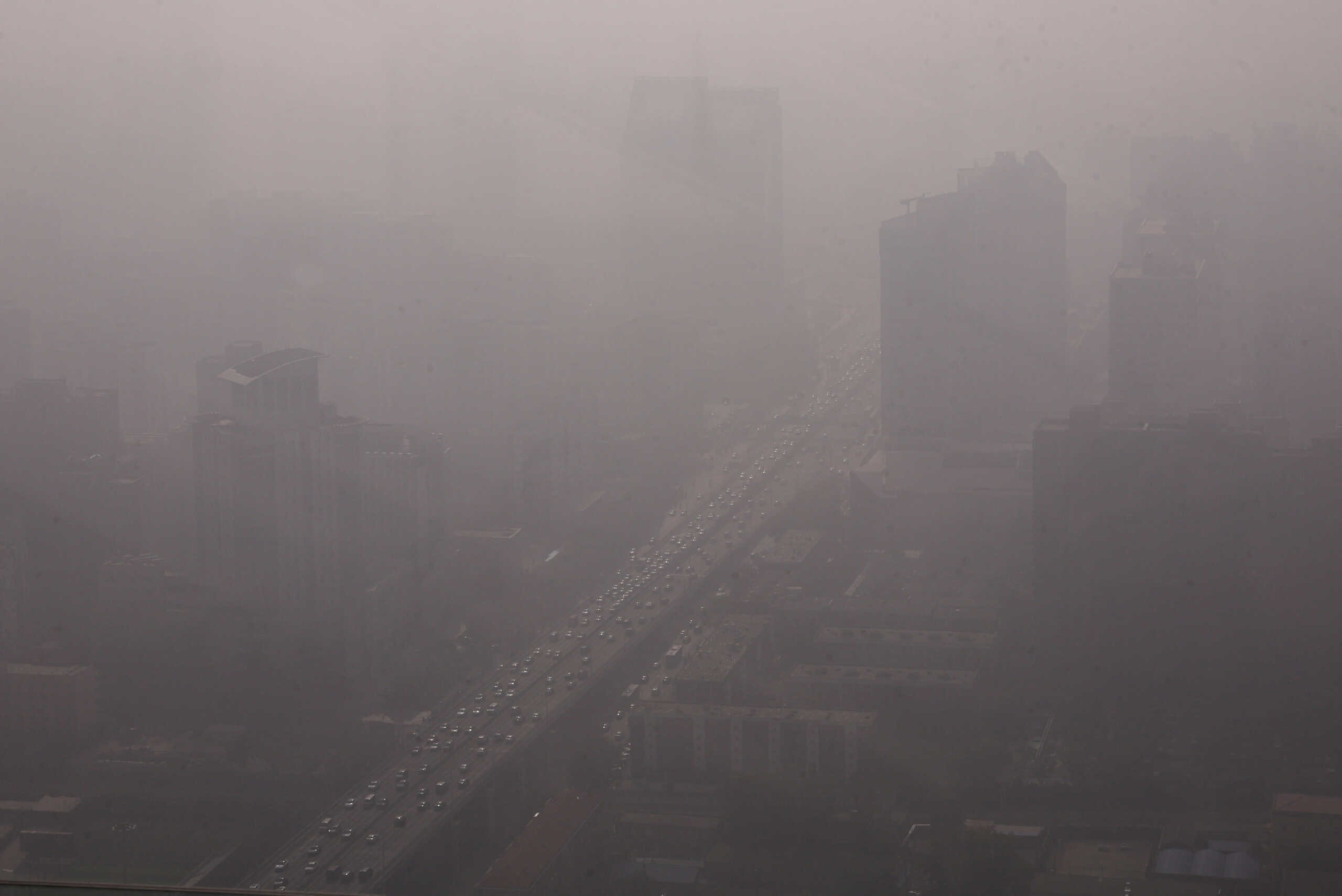 Vehicles move on a street in Beijing's Central Business District (CBD) as the city is shrouded in smog, in China November 1, 2023. REUTER
