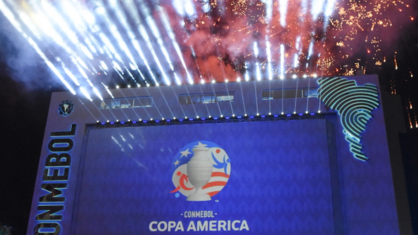 epa10752374 A projection of the Copa America 2024 image is displayed as fireworks go off over the Conmebol's building during the presentation of the image of Copa America 2024 in Luque, Paraguay, 17 July 203. The 48th edition of the Copa America soccer tournament will take place from 20 June to 14 July 2024 in the United States.  EPA