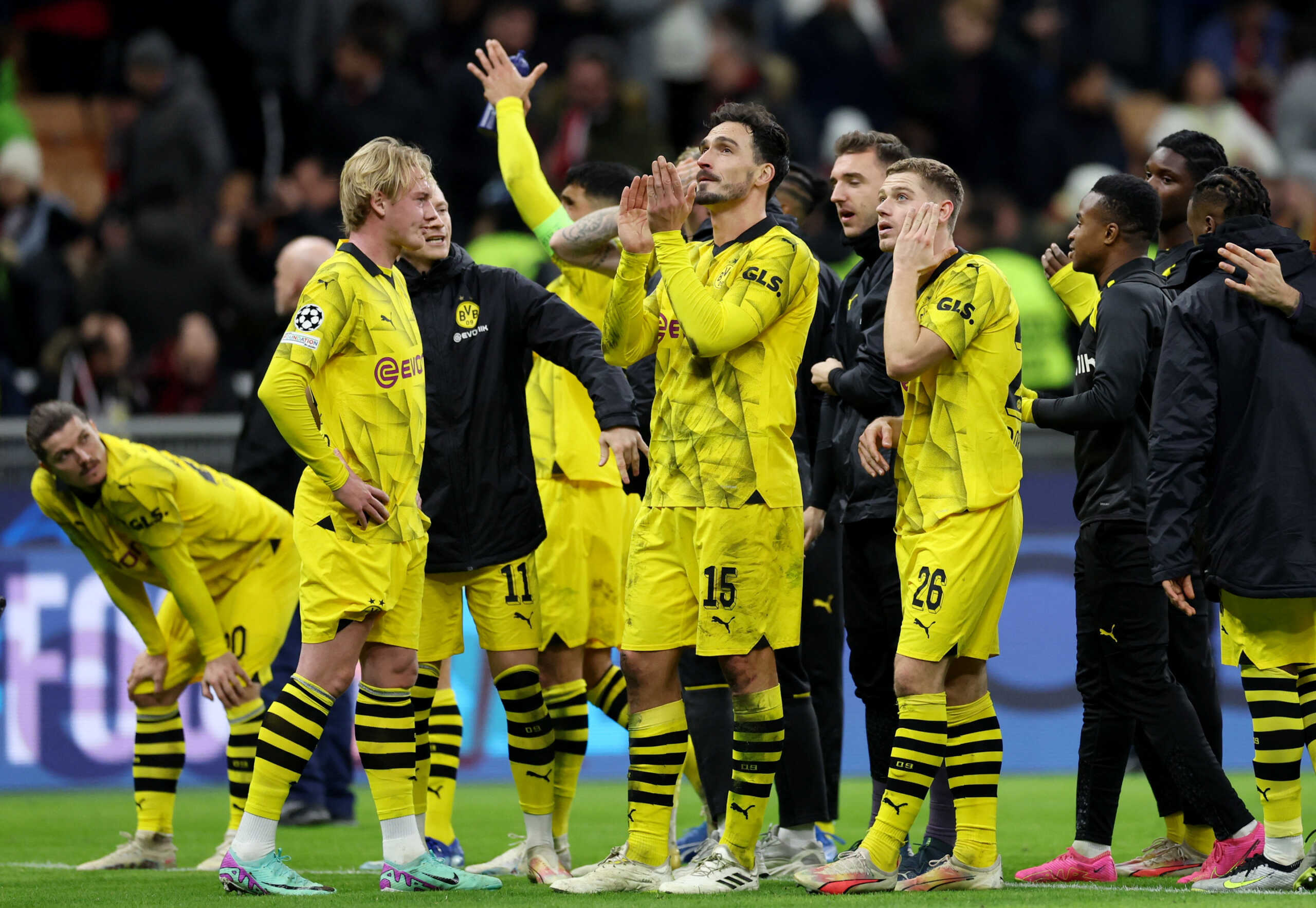 Soccer Football - Champions League - Group F - AC Milan v Borussia Dortmund - San Siro, Milan, Italy - November 28, 2023  Borussia Dortmund's Julian Brandt and Mats Hummels celebrate with teammates after the match REUTERS