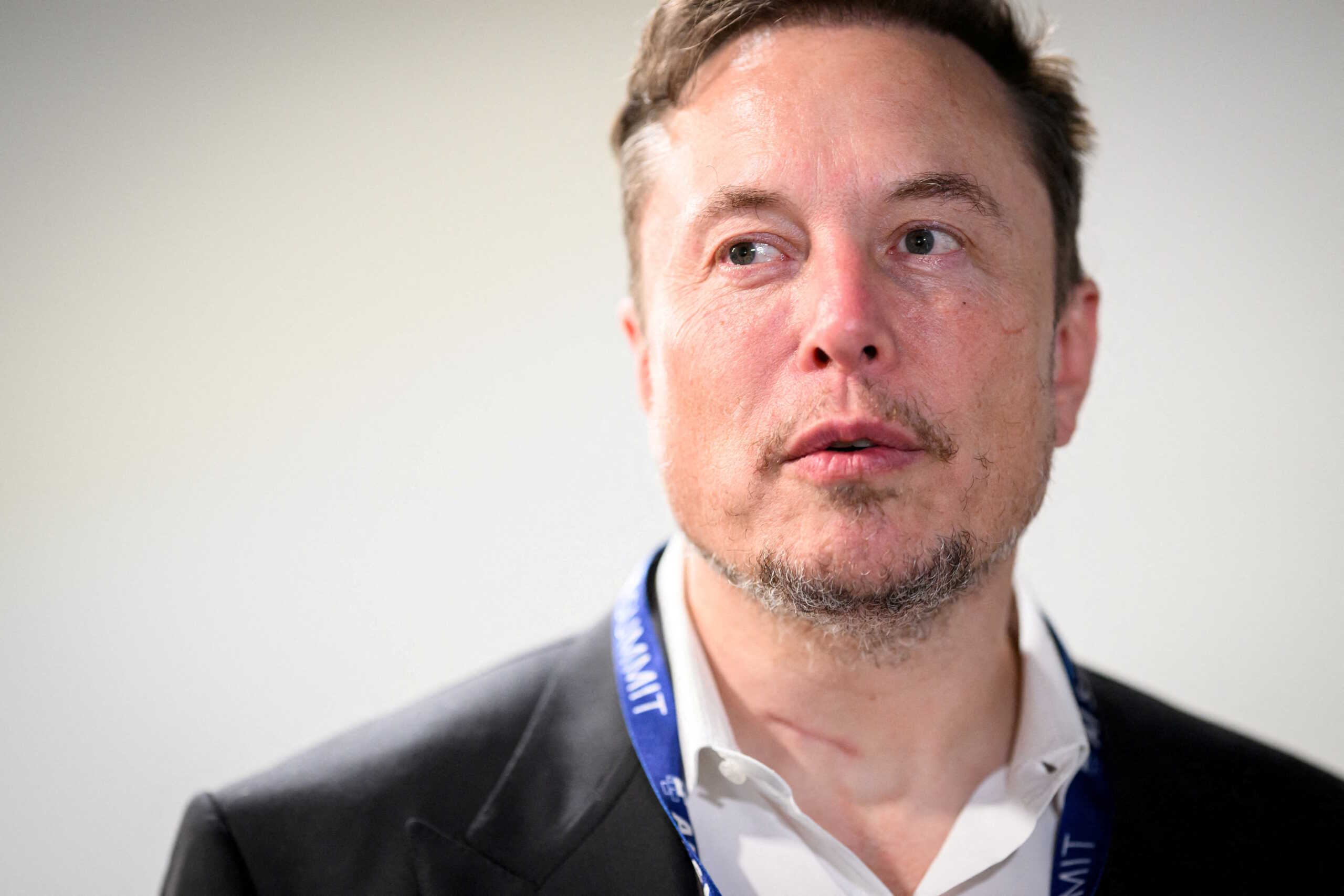 FILE PHOTO: Tesla, X (formerly known as Twitter) and SpaceX's CEO Elon Musk speaks with members of the media during the AI Safety Summit at Bletchley Park in Bletchley, Britain on November 1, 2023.  Leon Neal