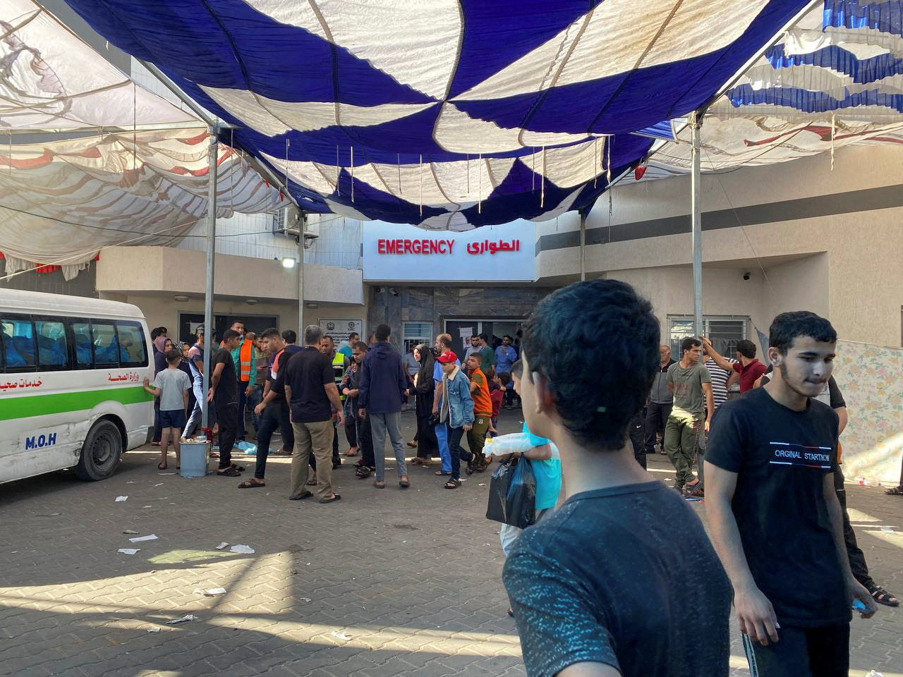 People, including Palestinian children, who fled their house due to Israeli strikes, gather at Al Shifa hospital where they shelter, amid the ongoing conflict between Israel and Palestinian Islamist group Hamas, in Gaza City November 7, 2023. REUTERS