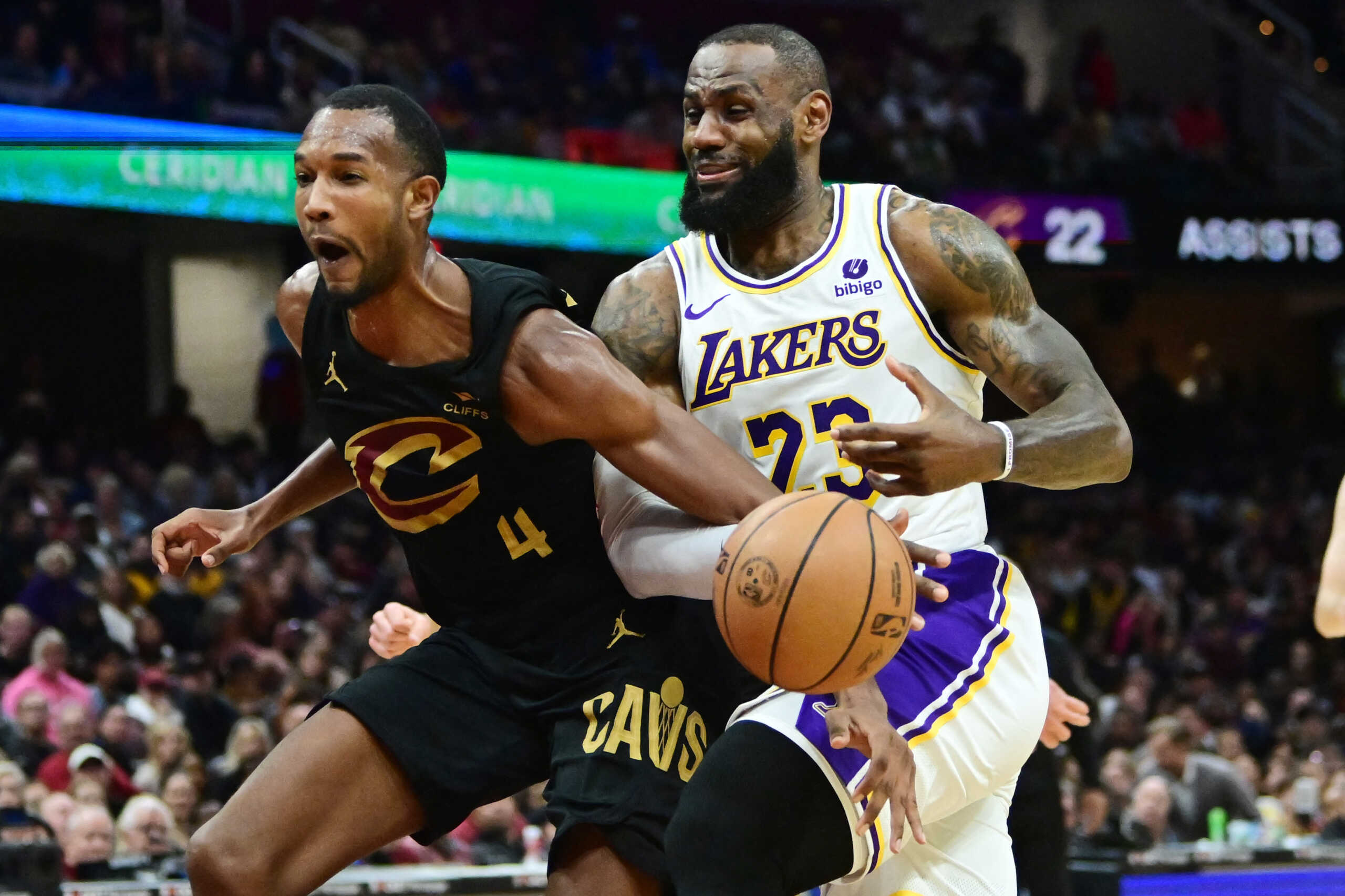 Nov 25, 2023; Cleveland, Ohio, USA; Cleveland Cavaliers forward Evan Mobley (4) fouls Los Angeles Lakers forward LeBron James (23) during the second half at Rocket Mortgage FieldHouse. Mandatory Credit: Ken Blaze-USA TODAY Sports