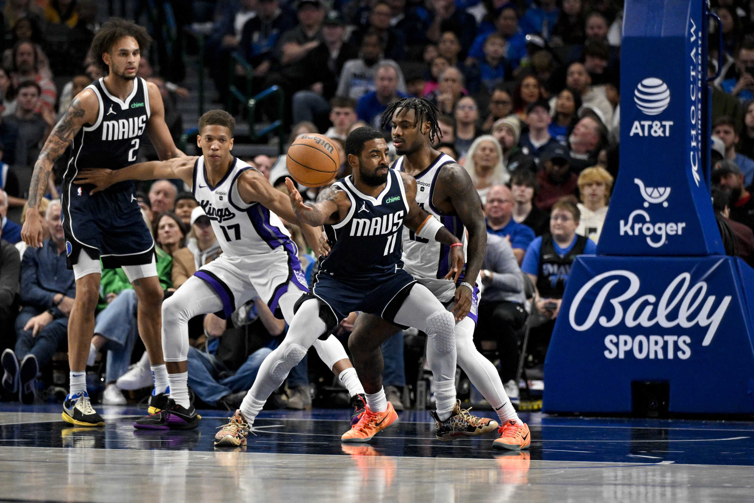 Nov 19, 2023; Dallas, Texas, USA; Dallas Mavericks guard Kyrie Irving (11) attempts to control the ball in front of Sacramento Kings guard Davion Mitchell (15) during the second half at the American Airlines Center. Mandatory Credit: Jerome Miron-USA TODAY Sports