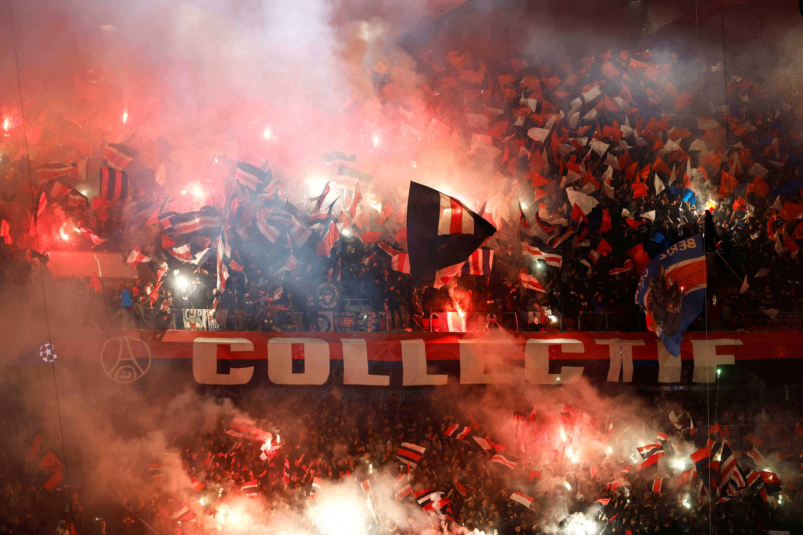 Soccer Football - Champions League - Group F - Paris St Germain v AC Milan - Parc des Princes, Paris, France - October 25, 2023 Paris St Germain fans wave flags and let off flares inside the stadium before the match REUTERS