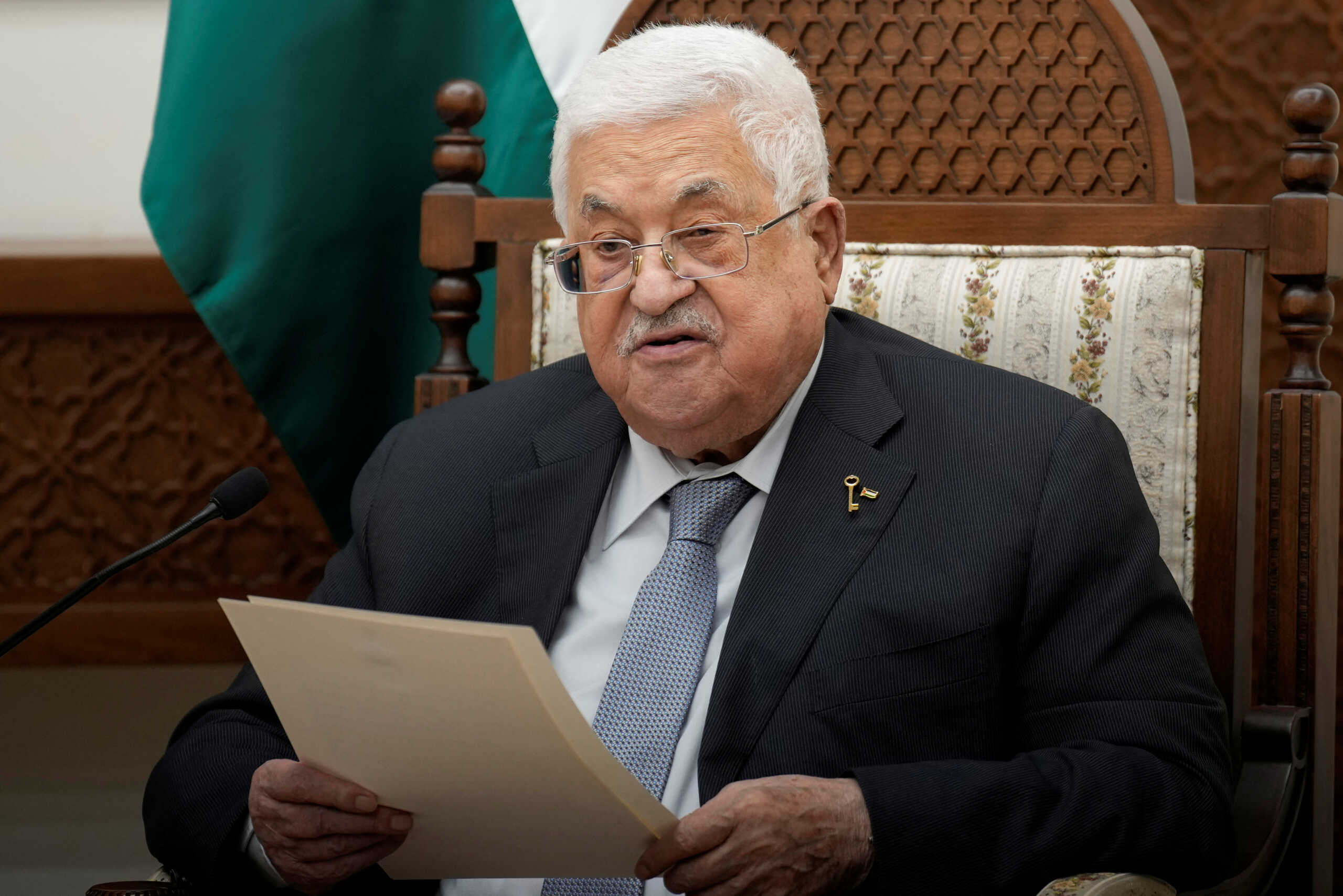 Palestinian President Mahmoud Abbas reads a statement as he meets French President Emmanuel Macron, in Ramallah, West Bank, October 24, 2023. French President Emmanuel Macron visited Israel on Tuesday, where he reaffirmed calls to prevent the war from expanding into Lebanon and the wider Arab world, and called for a "decisive" political process with the Palestinians for a viable peace. Christophe Ena