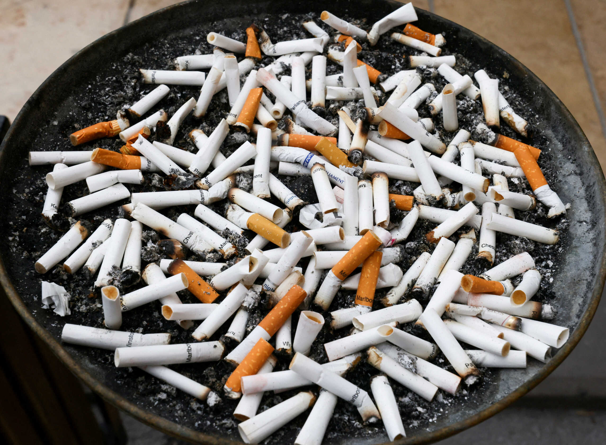 FILE PHOTO: Cigarette butts are seen in an ashtray, in Ankara, Turkey May 13, 2023. REUTERS