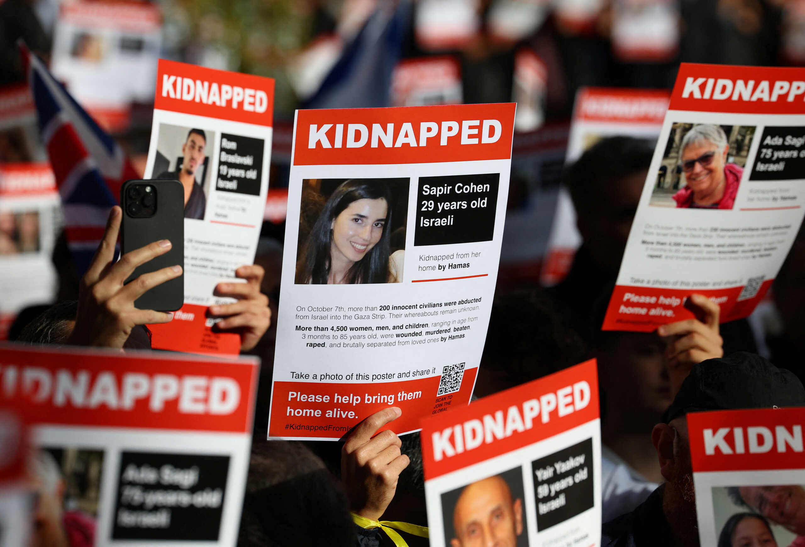 Families and supporters of hostages that are being held in Gaza after they were kidnapped from Israel by Hamas gunmen on October 7, hold a demonstration to demand their immediate release, outside of the Houses of Parliament in London, Britain, November 5, 2023. REUTERS