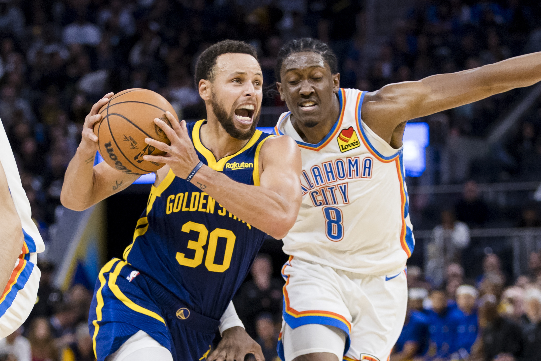 Nov 18, 2023; San Francisco, California, USA; Golden State Warriors guard Stephen Curry (30) drives to the basket as Oklahoma City Thunder forward Jalen Williams (8) defends during the second half at Chase Center. Mandatory Credit: John Hefti-USA TODAY Sports