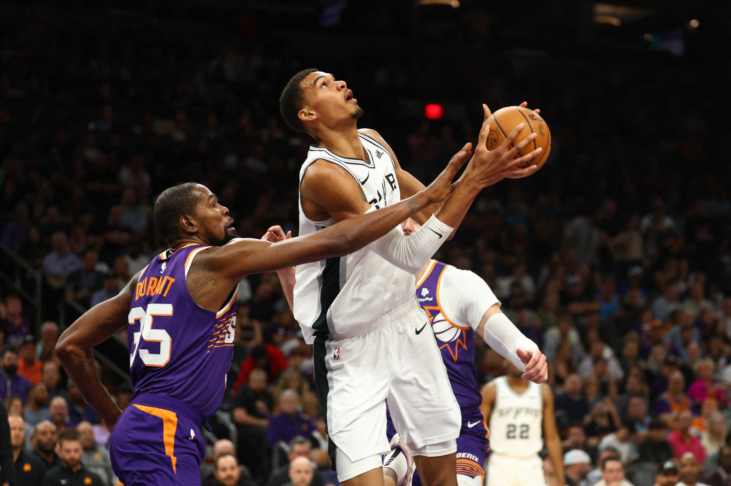 Nov 2, 2023; Phoenix, Arizona, USA; San Antonio Spurs center Victor Wembanyama (1) drives to the basket against Phoenix Suns forward Kevin Durant (35) in the second half at Footprint Center. Mandatory Credit: Mark J. Rebilas-USA TODAY Sports