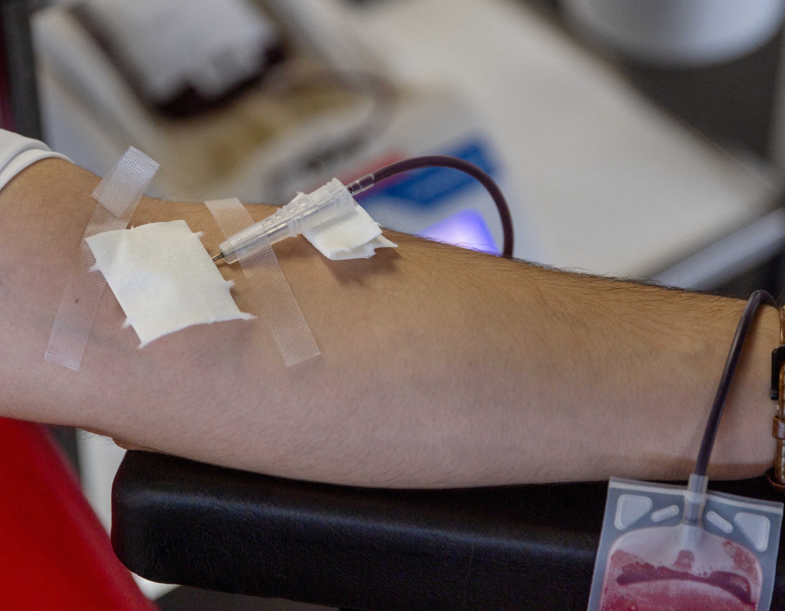Gabriel Delabays gives blood after Switzerland lifted long-standing restrictions on gay men giving blood, at the transfusion center CRS in Epalinges near Lausanne, Switzerland, November 1, 2023.  REUTERS