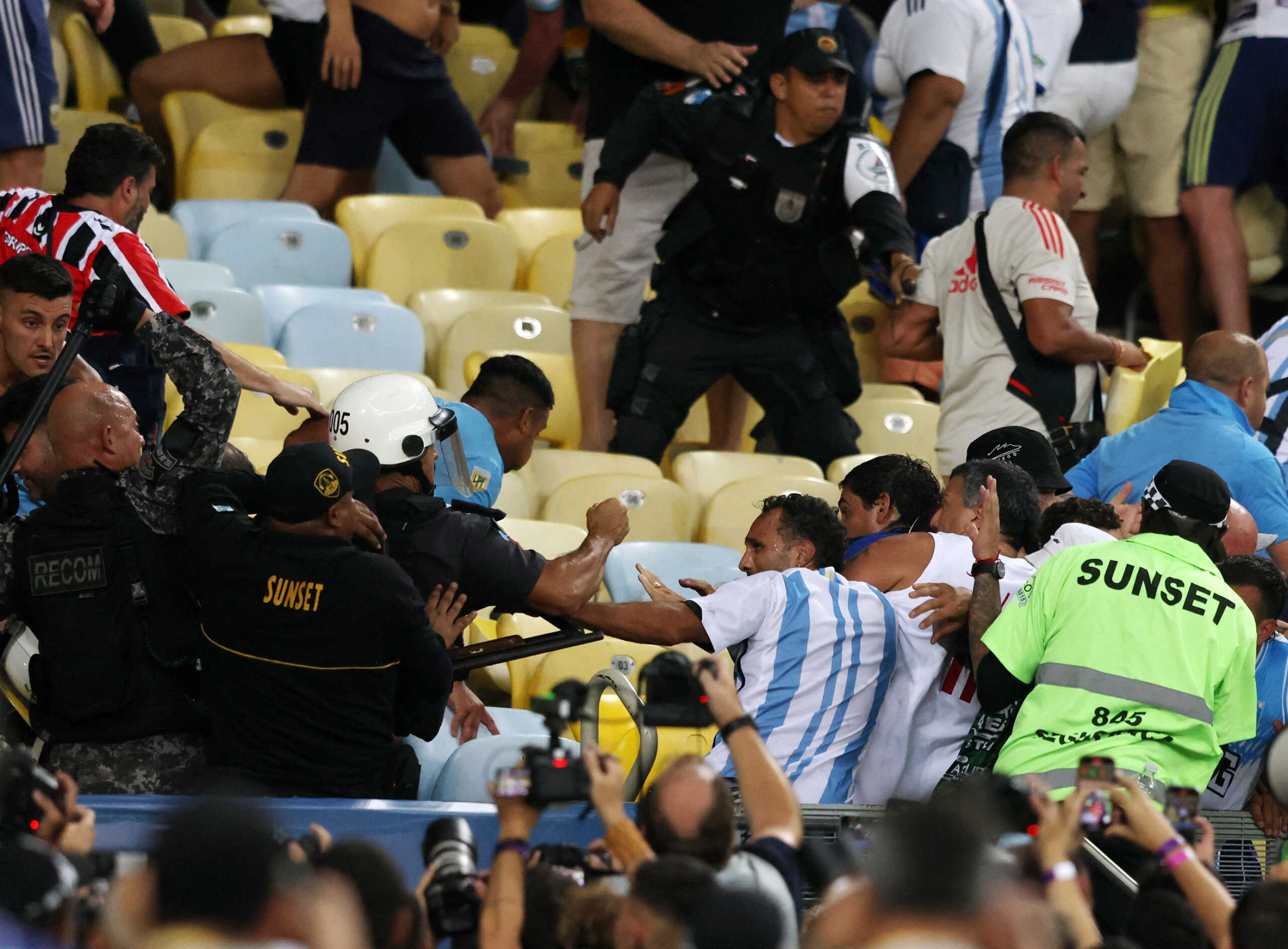 Soccer Football - World Cup - South American Qualifiers - Brazil v Argentina - Estadio Maracana, Rio de Janeiro, Brazil - November 21, 2023 Fans clash in the stands with security staff causing a delay to the start of the match REUTERS