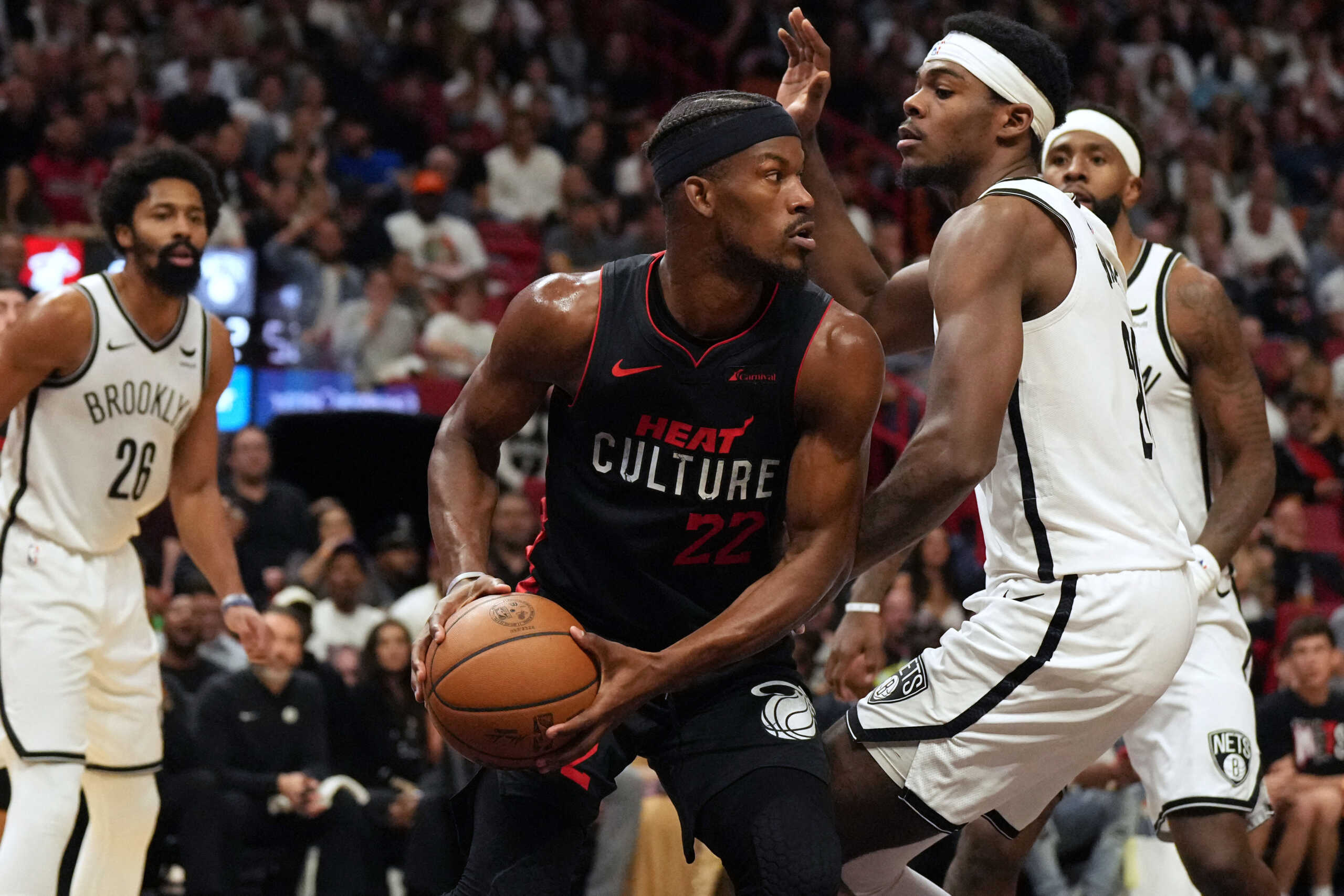 Nov 16, 2023; Miami, Florida, USA; Miami Heat forward Jimmy Butler (22) looks to pass the ball as Brooklyn Nets center Day'Ron Sharpe (20) defends  in the first half at Kaseya Center. Mandatory Credit: Jim Rassol-USA TODAY Sports